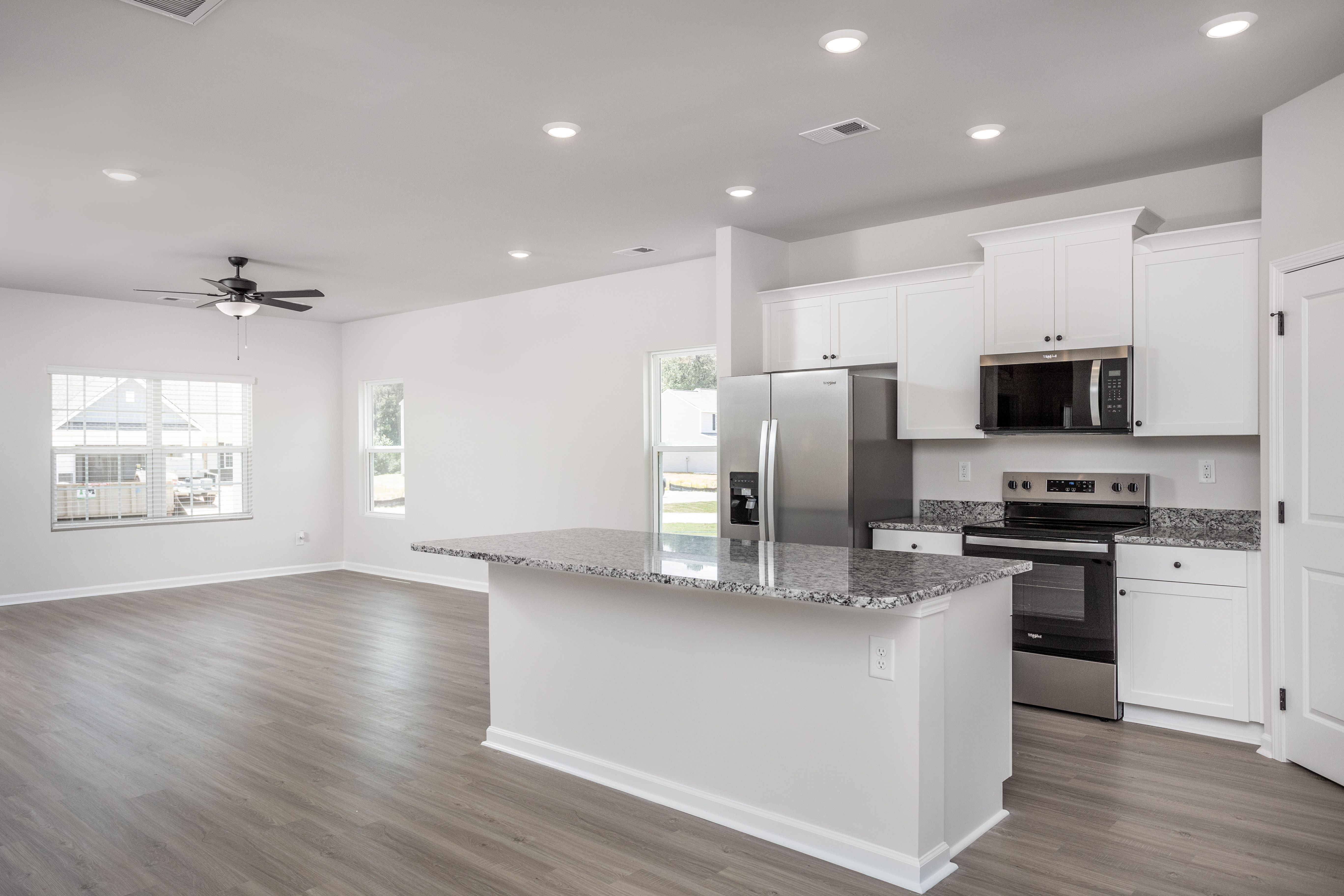 The kitchen opens to the family room and dining room.