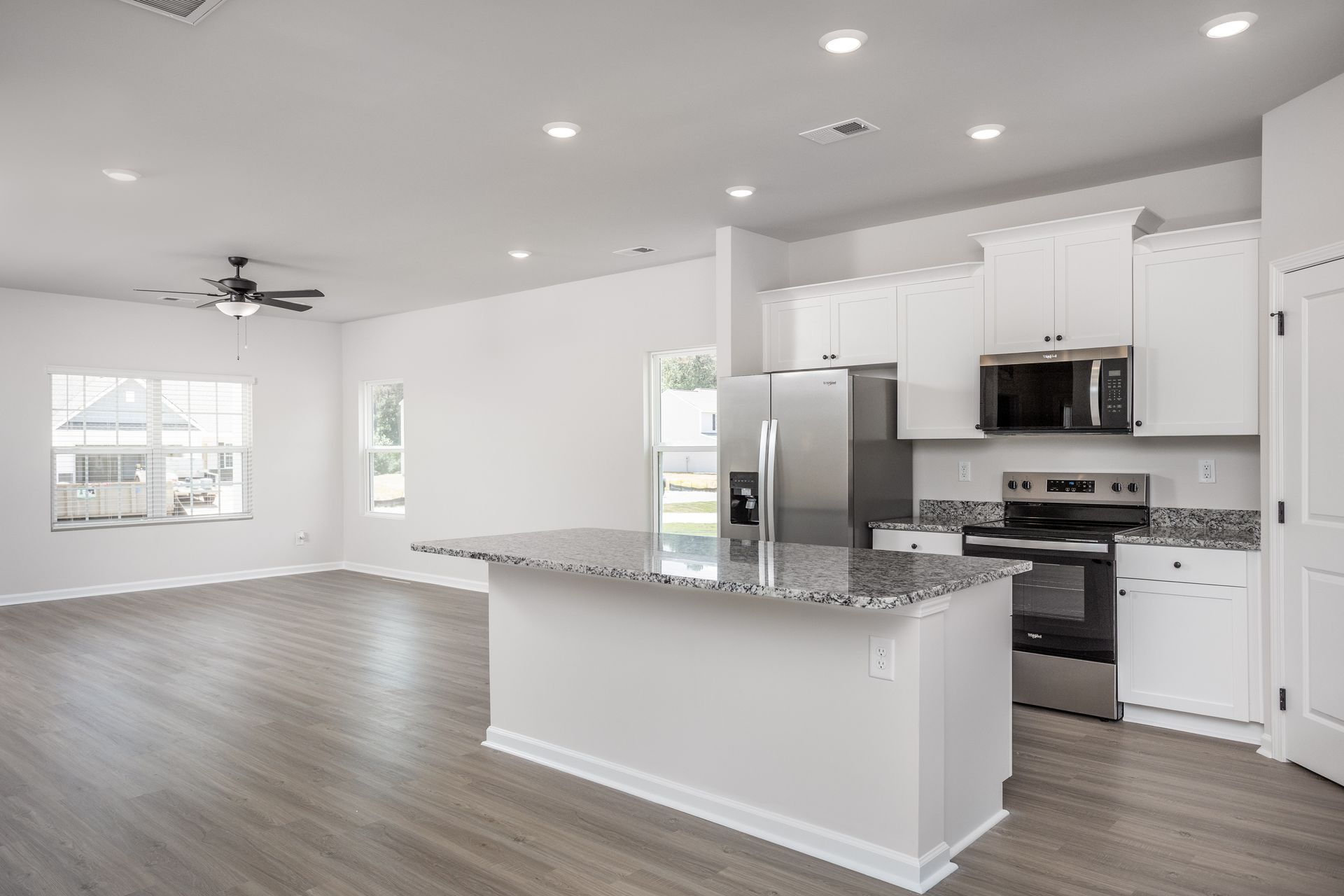 The kitchen opens to the family room and dining room.