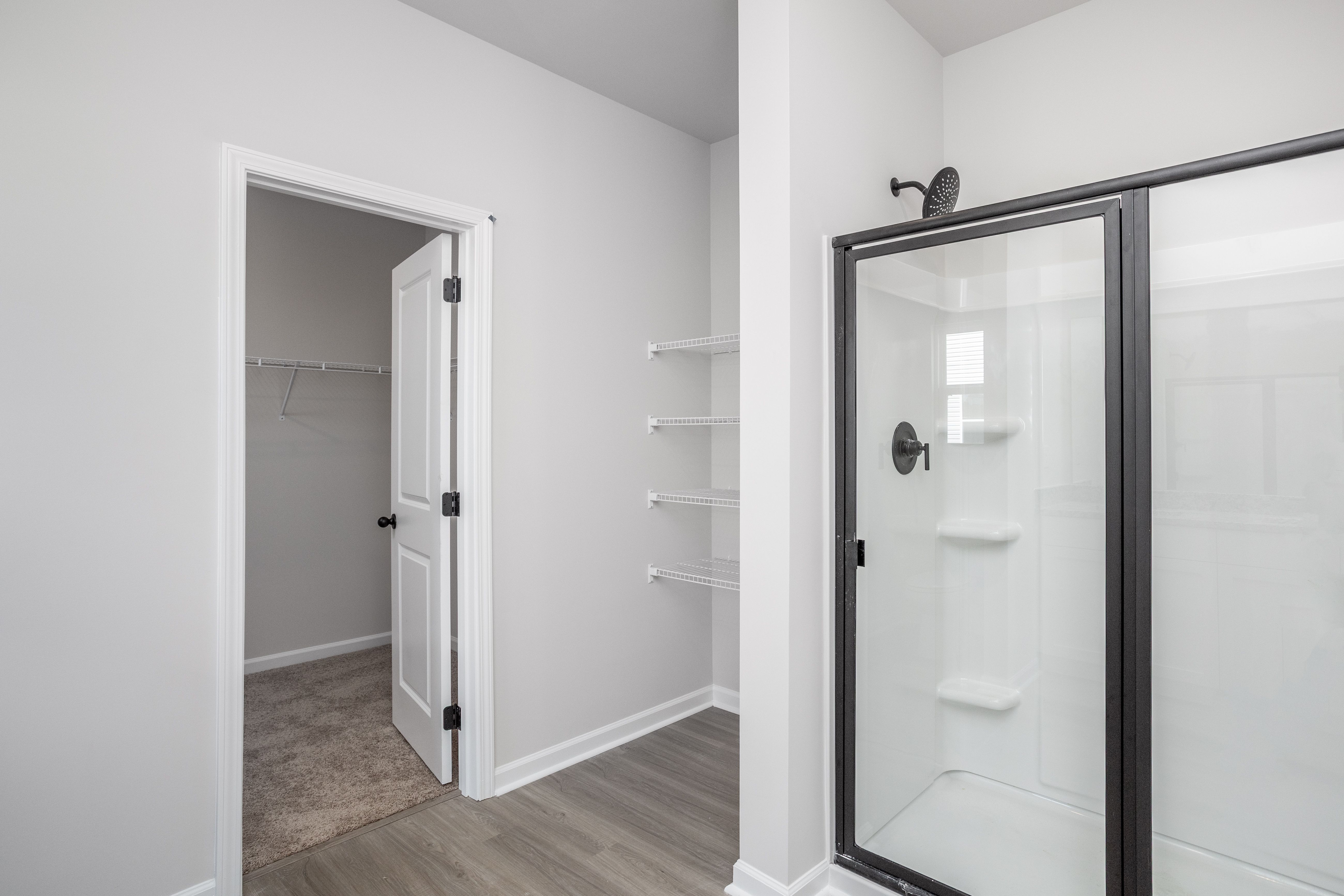 This bathroom has a glass-enclosed shower