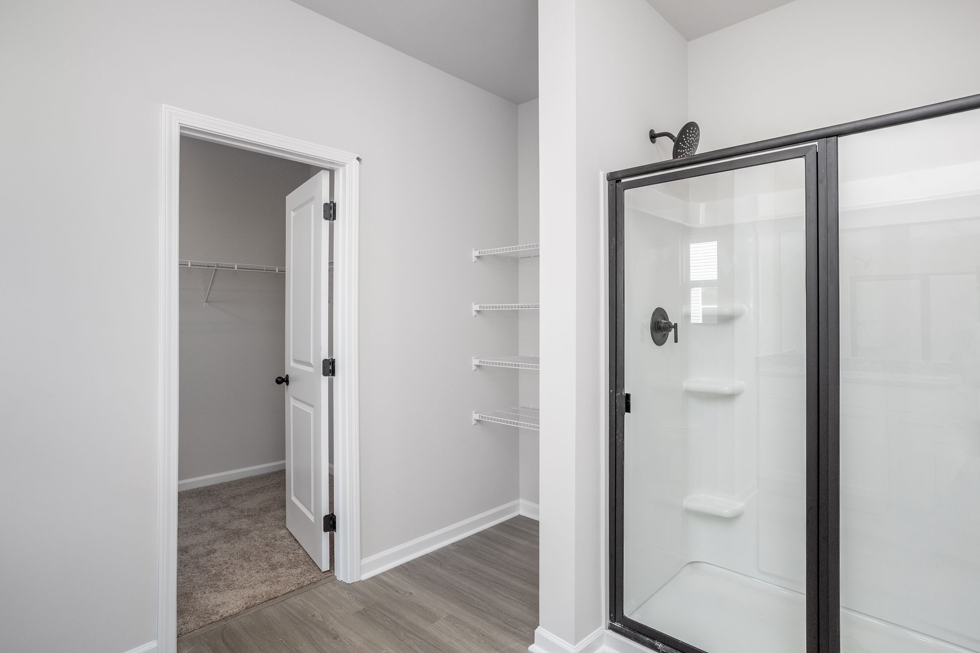 This bathroom has a glass-enclosed shower