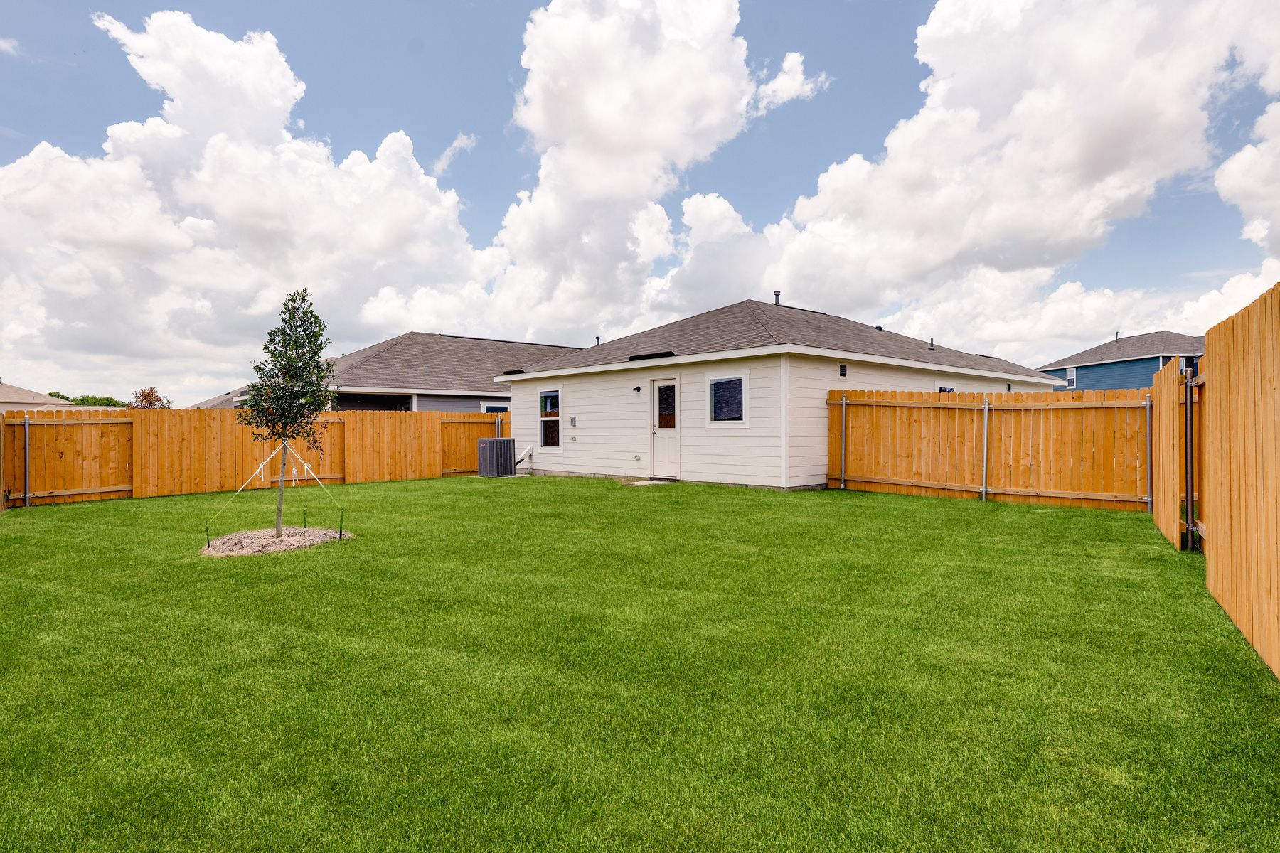The back yard of the Ash is fully fenced-in.