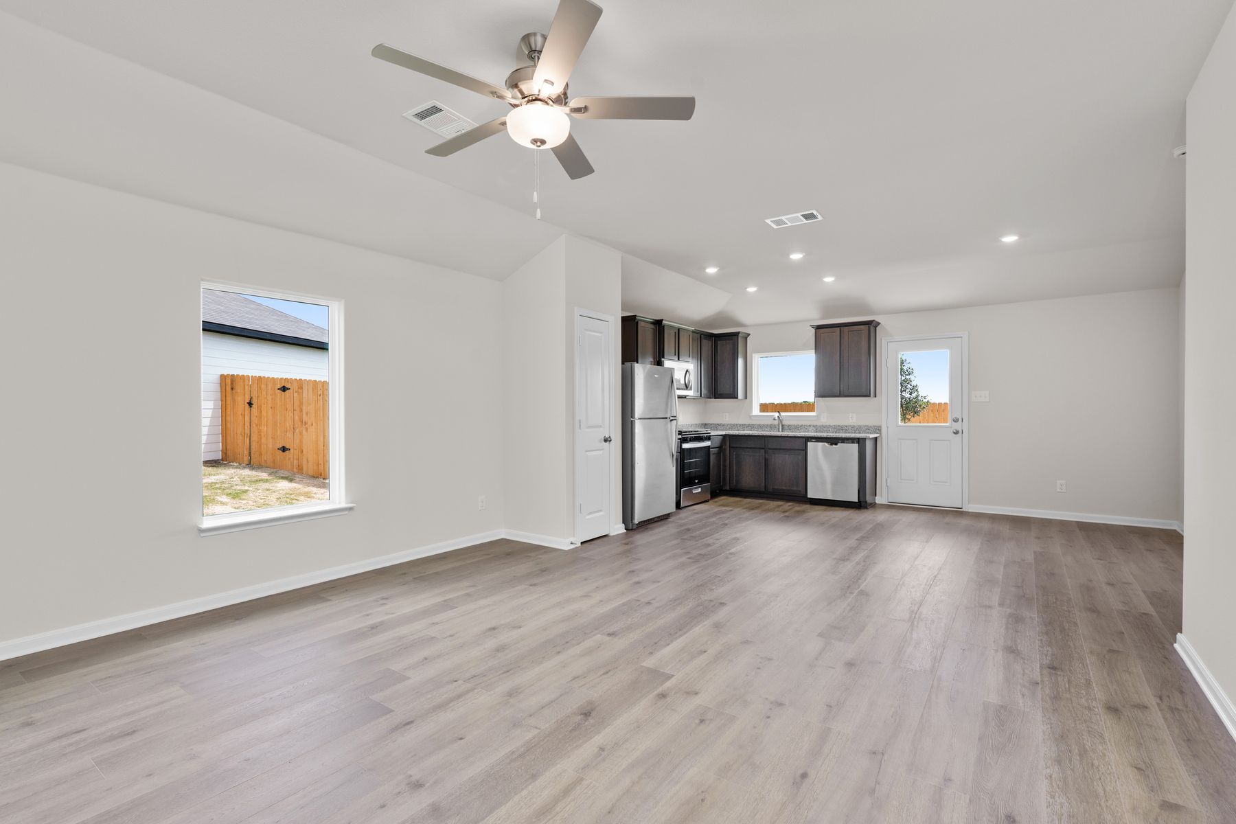 The living room has a large window that lets in great, natural light.