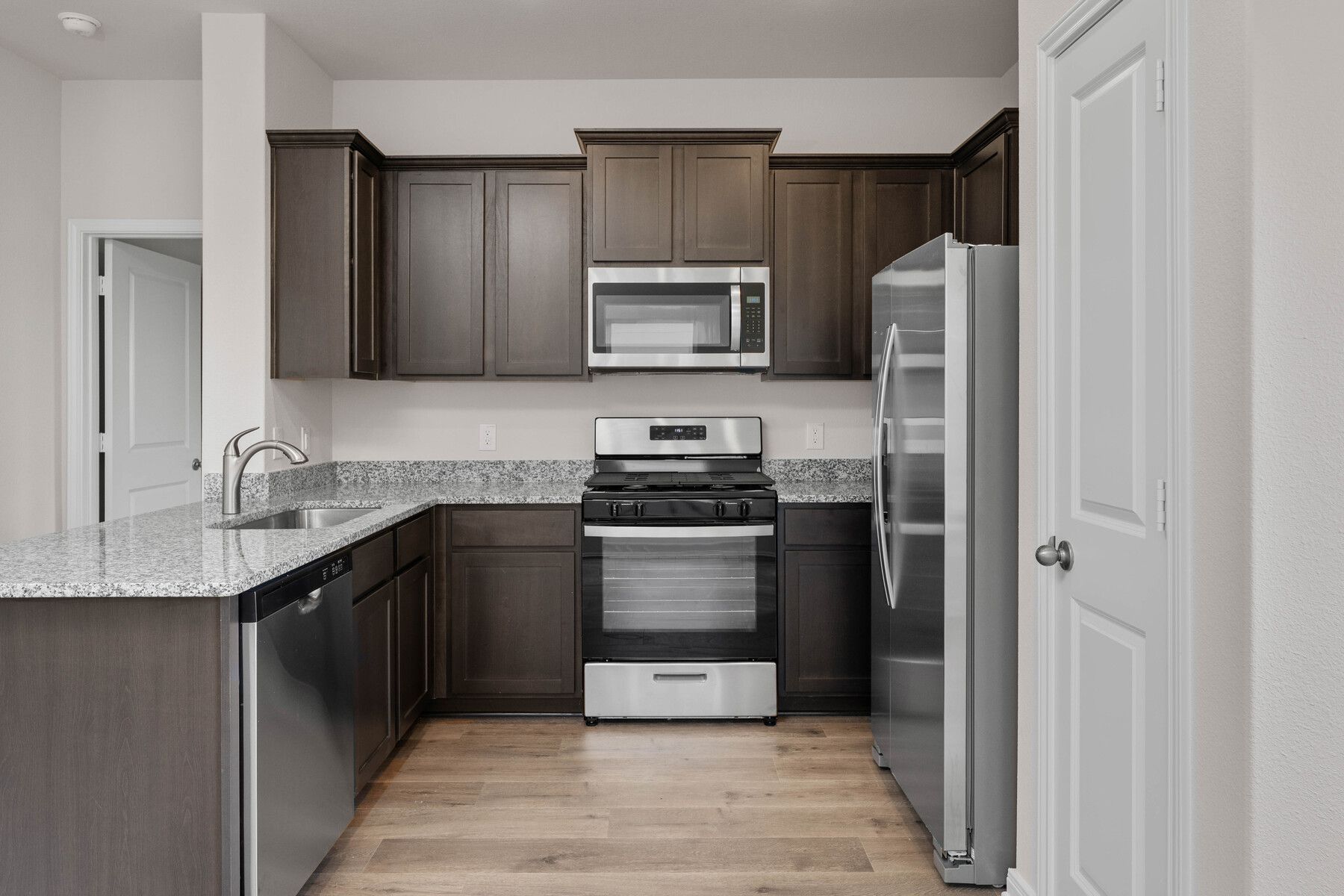 The kitchen has energy-efficient, stainless-steel appliances.