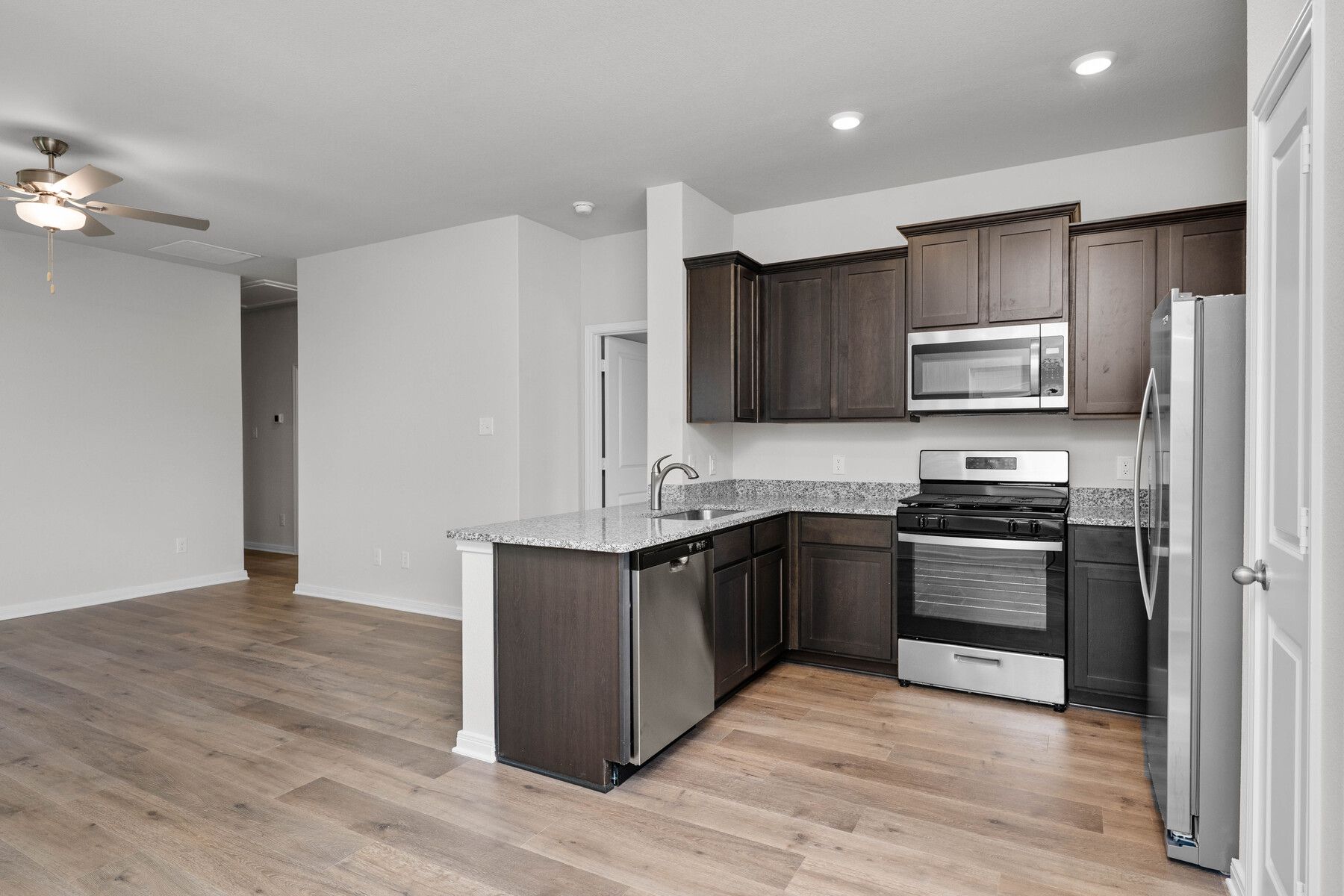 The kitchen has sprawling granite countertops.