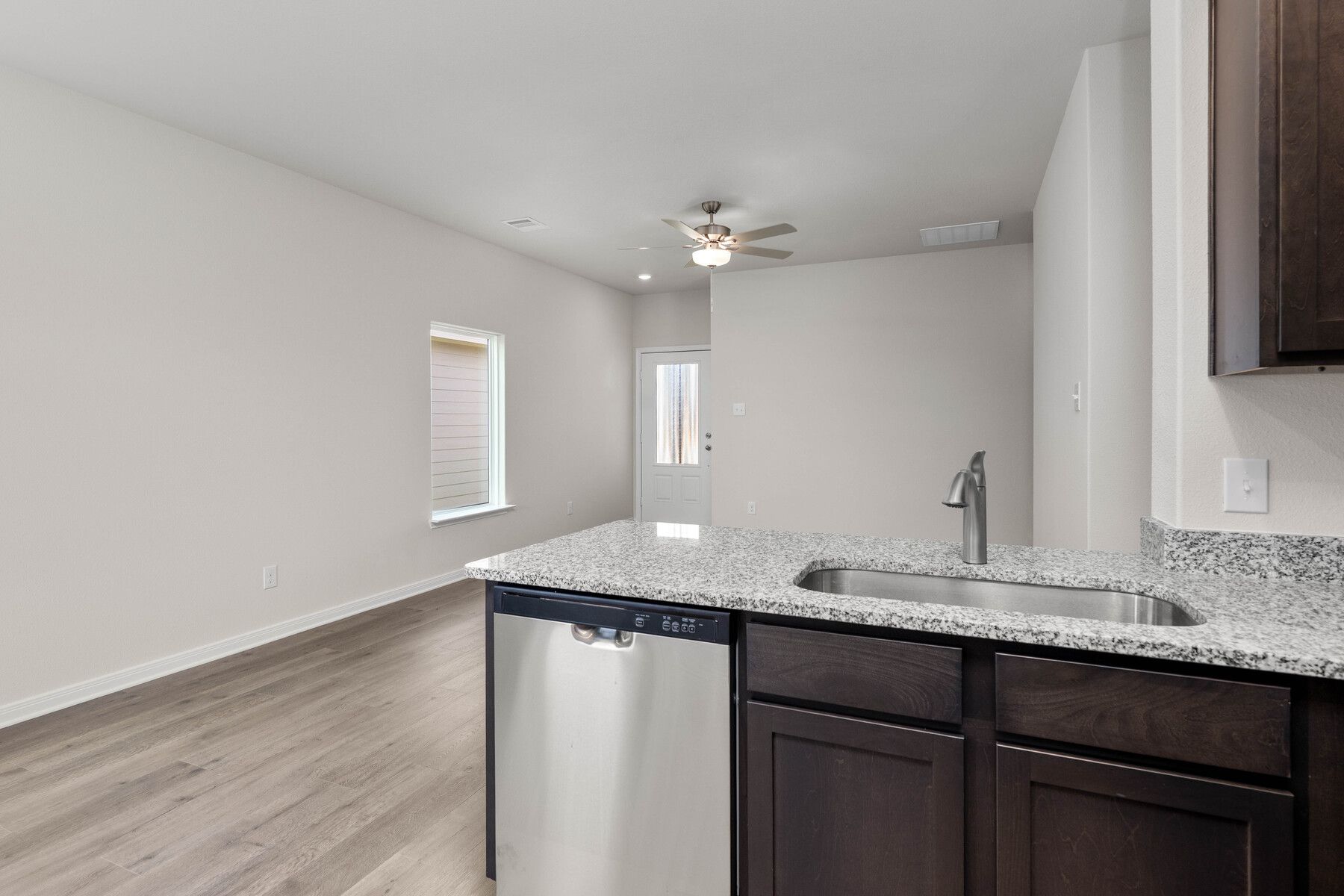The kitchen looks over into the family room.
