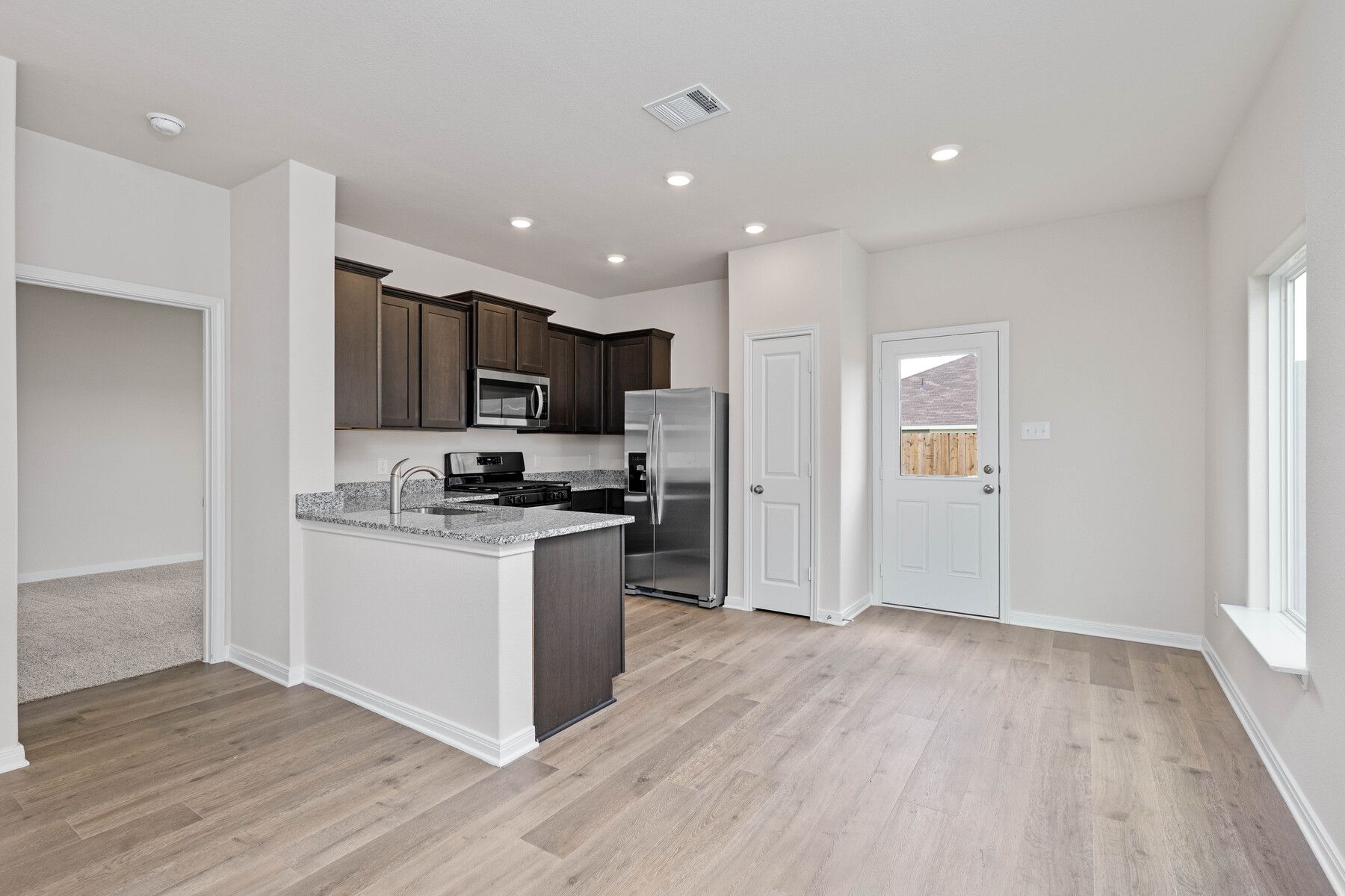 The kitchen and the dining room sit next to eachother for functionality.