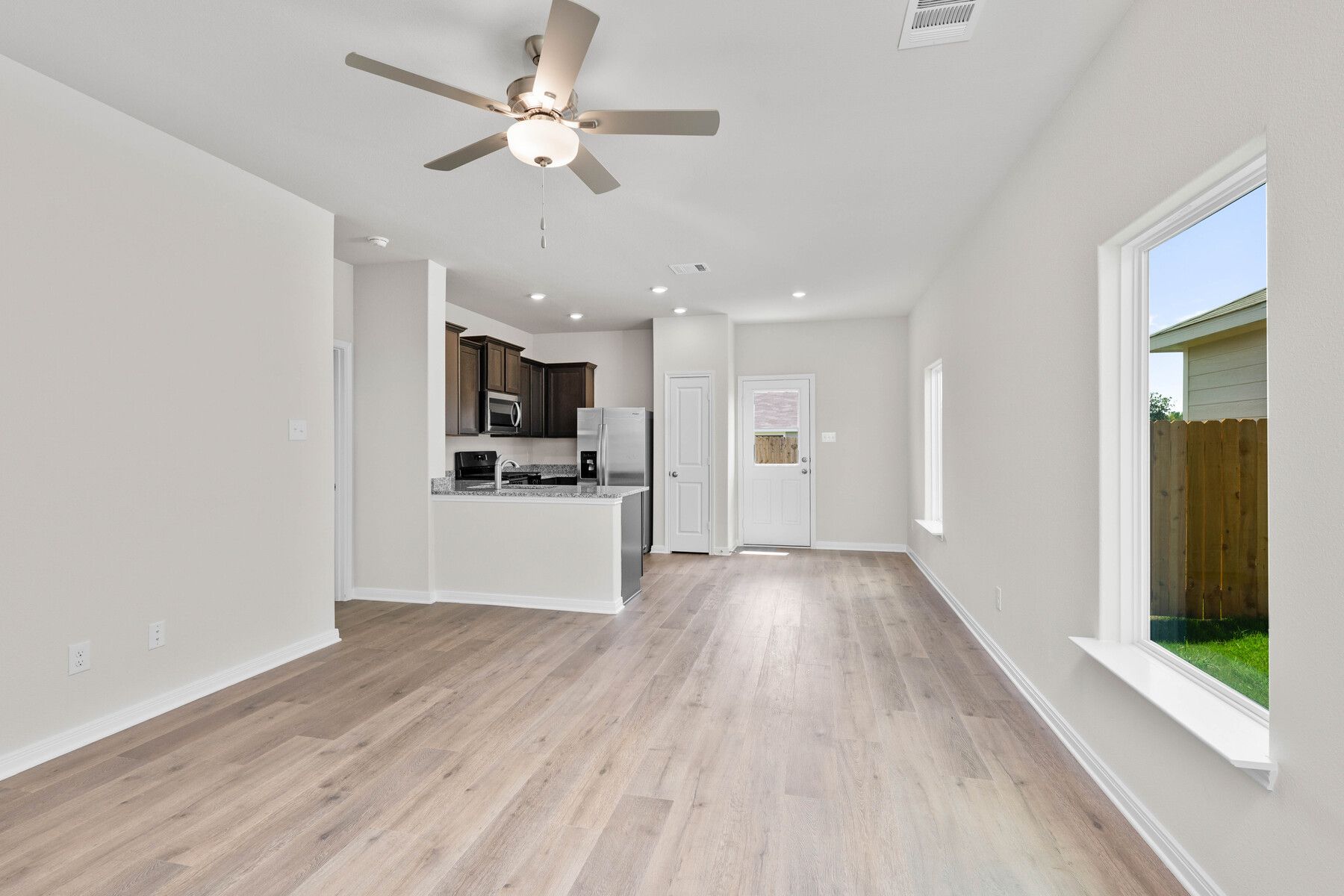 The open living spaces have large windows that let in great, natural light.