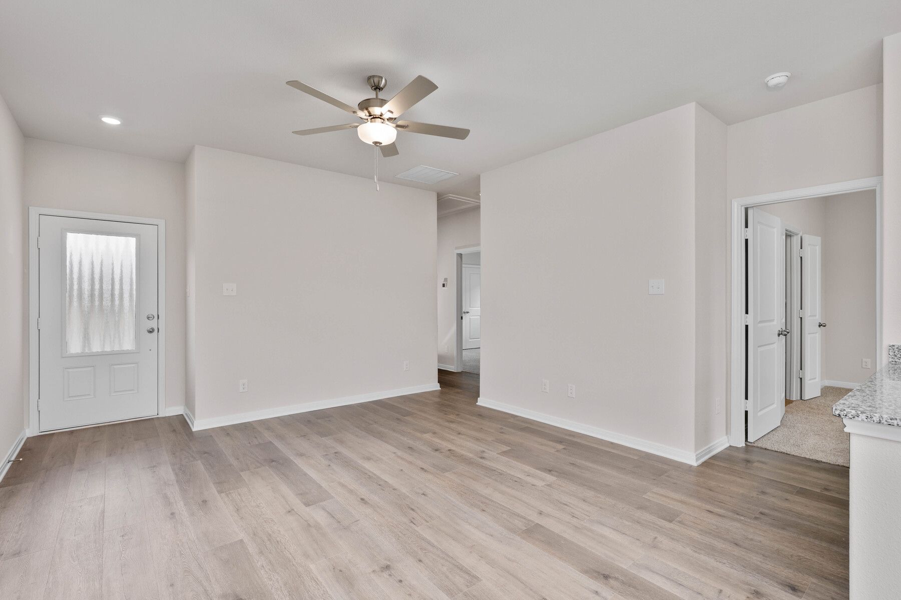 The spacious living room has space for large furniture, so everyone has a seat.