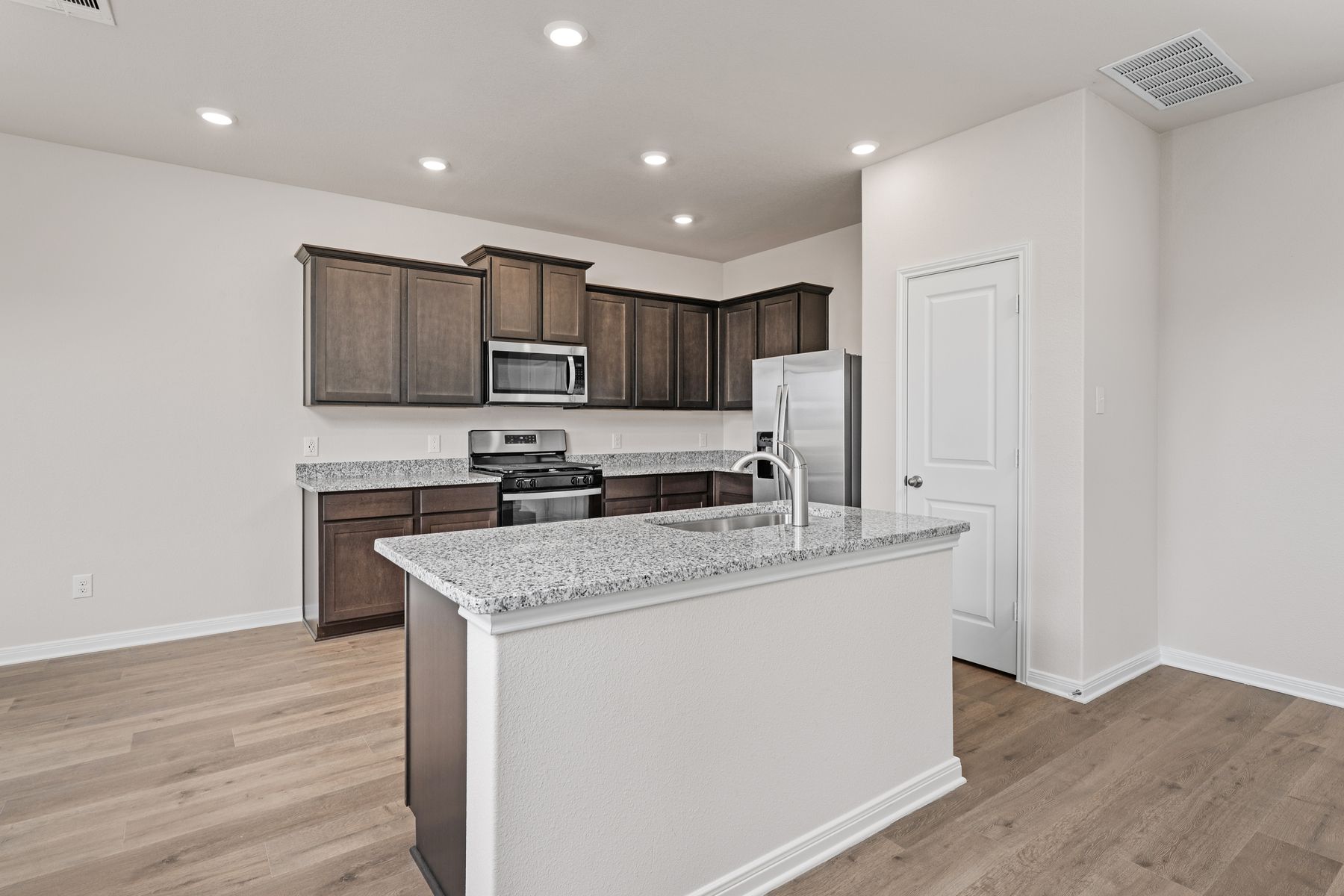 The kitchen island is a wonderful addition and helps with functionality. 