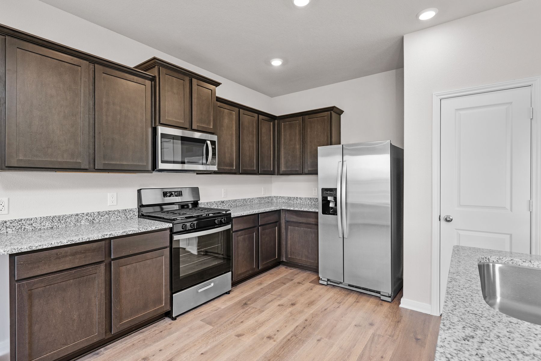 The kitchen has energy-efficient, stainless-steel appliances.
