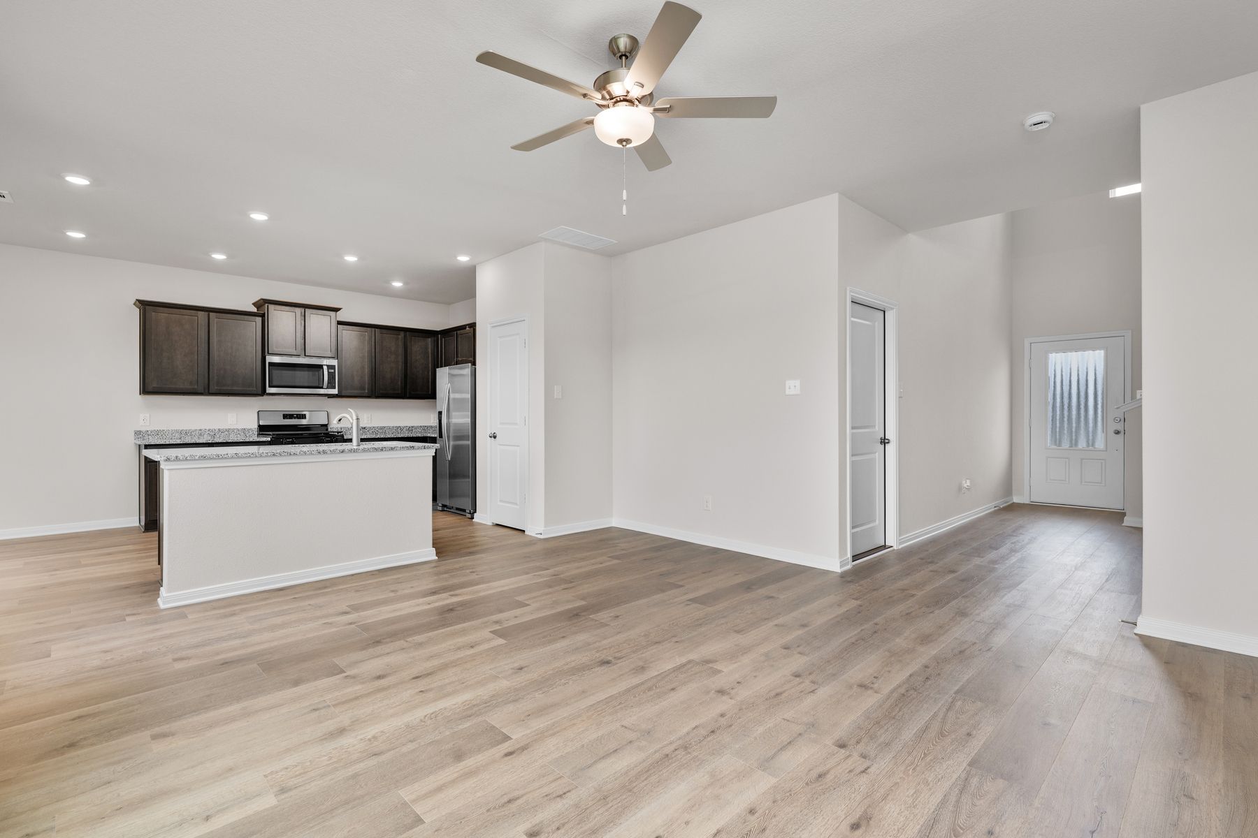 The foyer leads into the spacious living room.