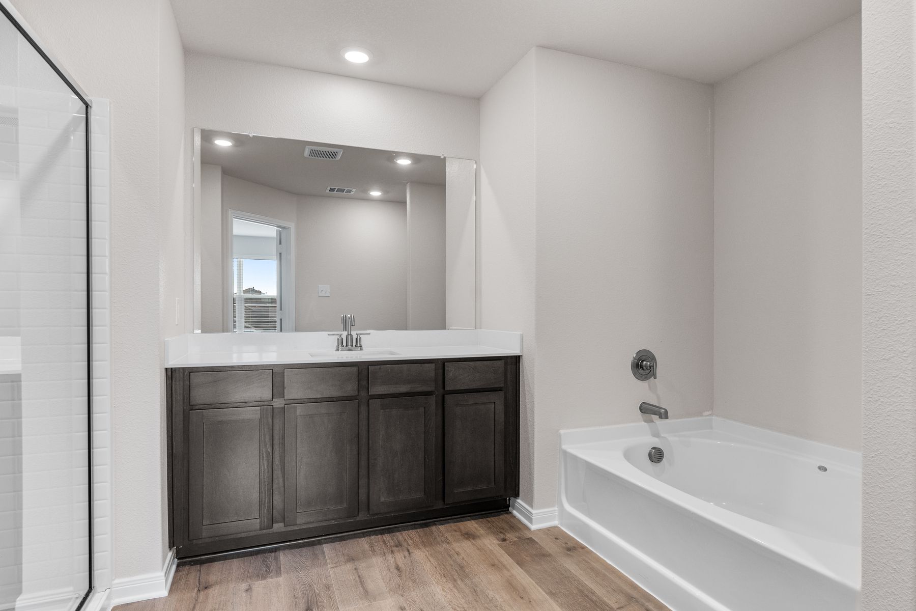 The master bathroom has a large garden tub.