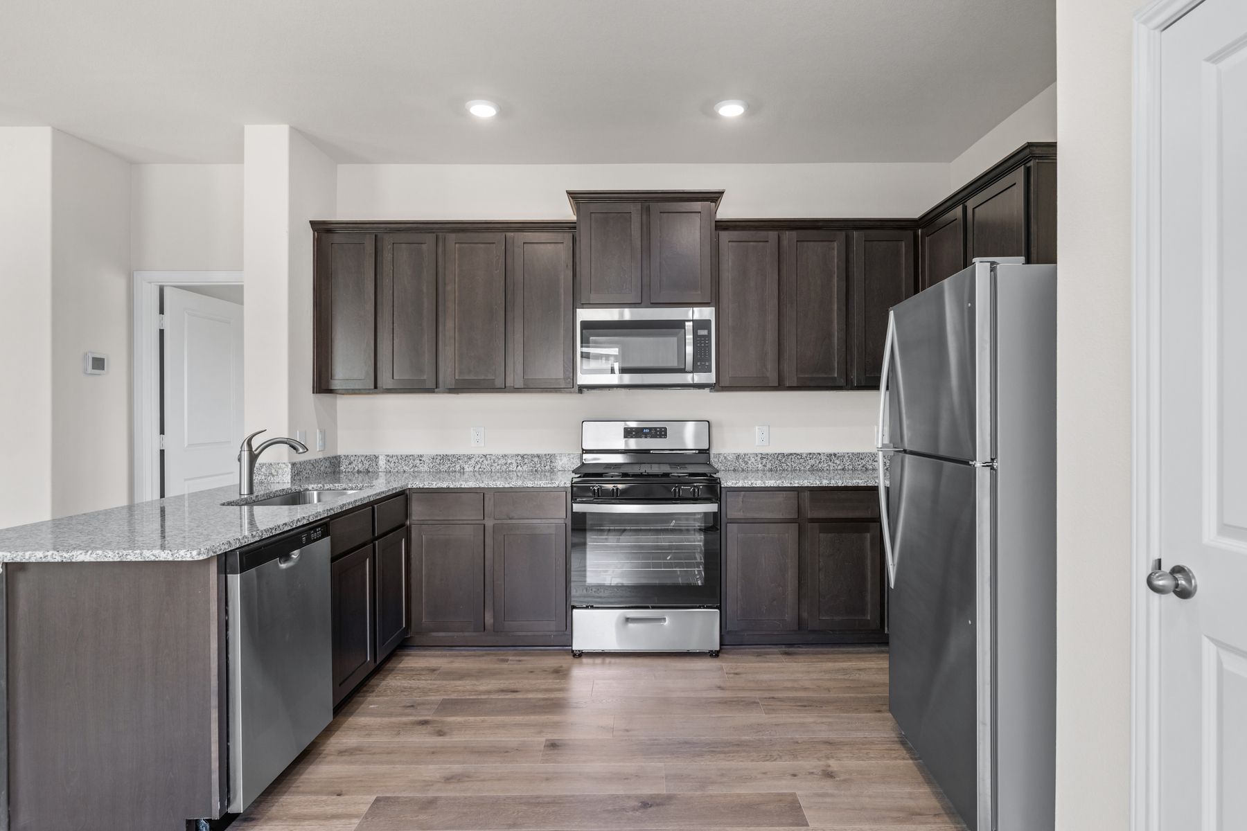 The kitchen has energy-efficient, stainless-steel appliances.