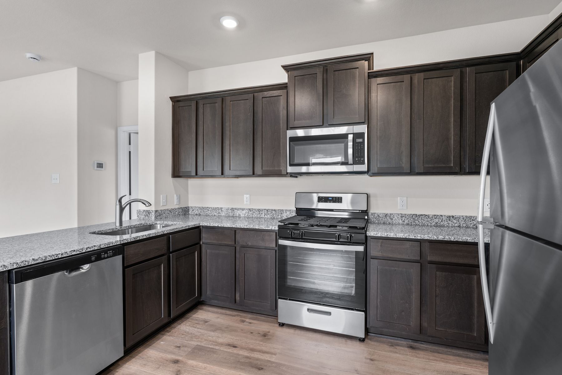 This beautiful kitchen has cabinet space for all of your kitchen essentials.