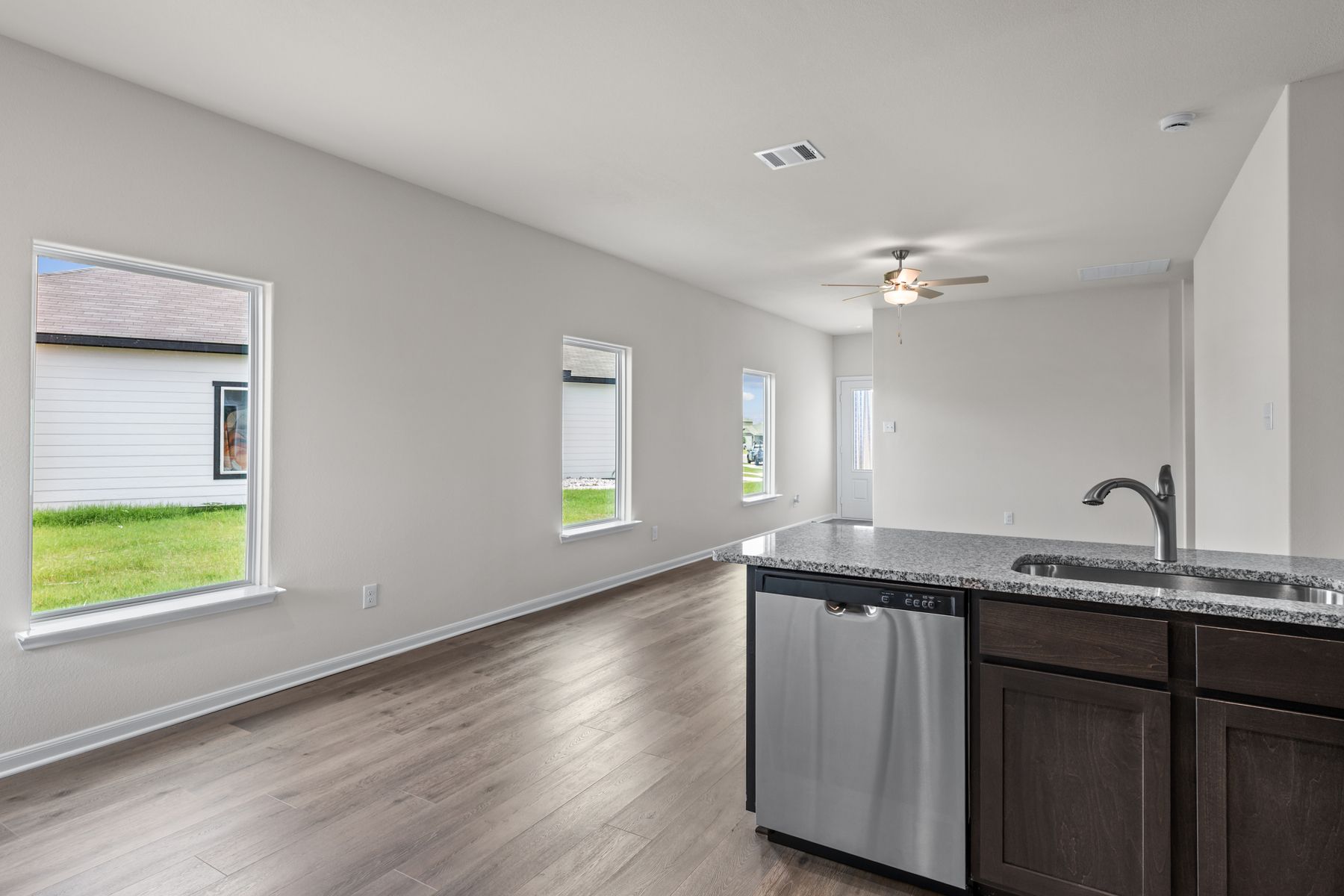 The kitchen looks over into the family room.