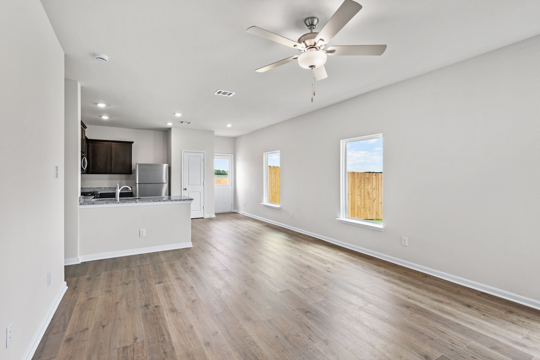 The open living spaces have large windows that let in great, natural light.