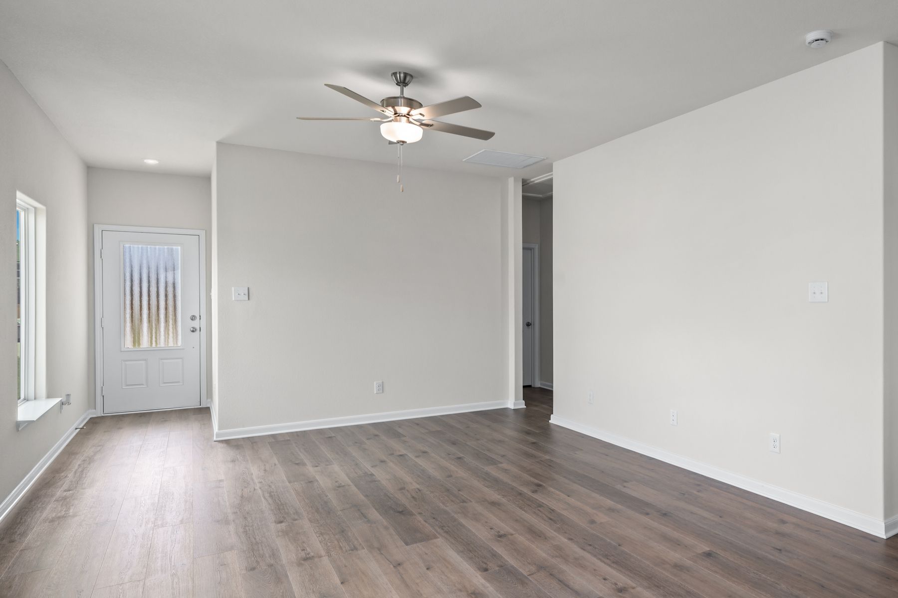 The spacious living room has space for large furniture, so everyone has a seat.