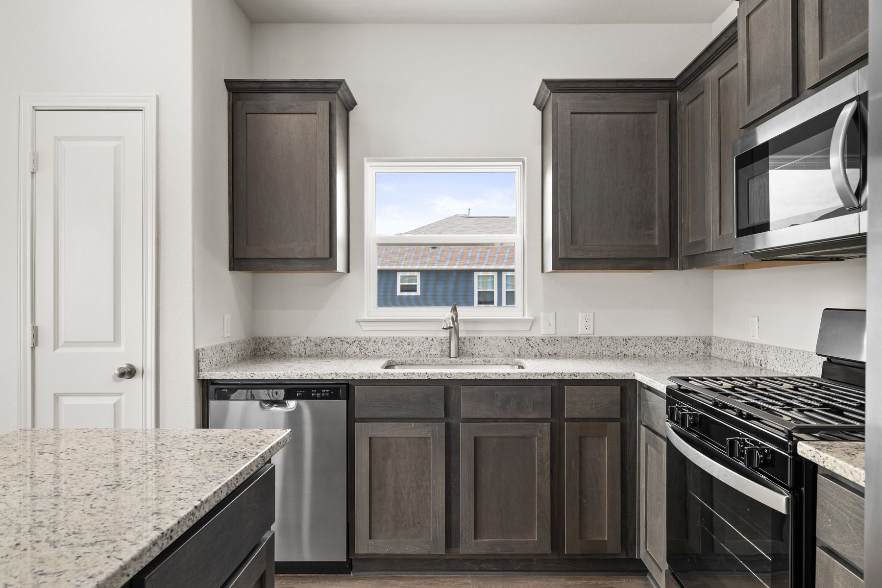 The kitchen has a large window that lets in great, natural light.