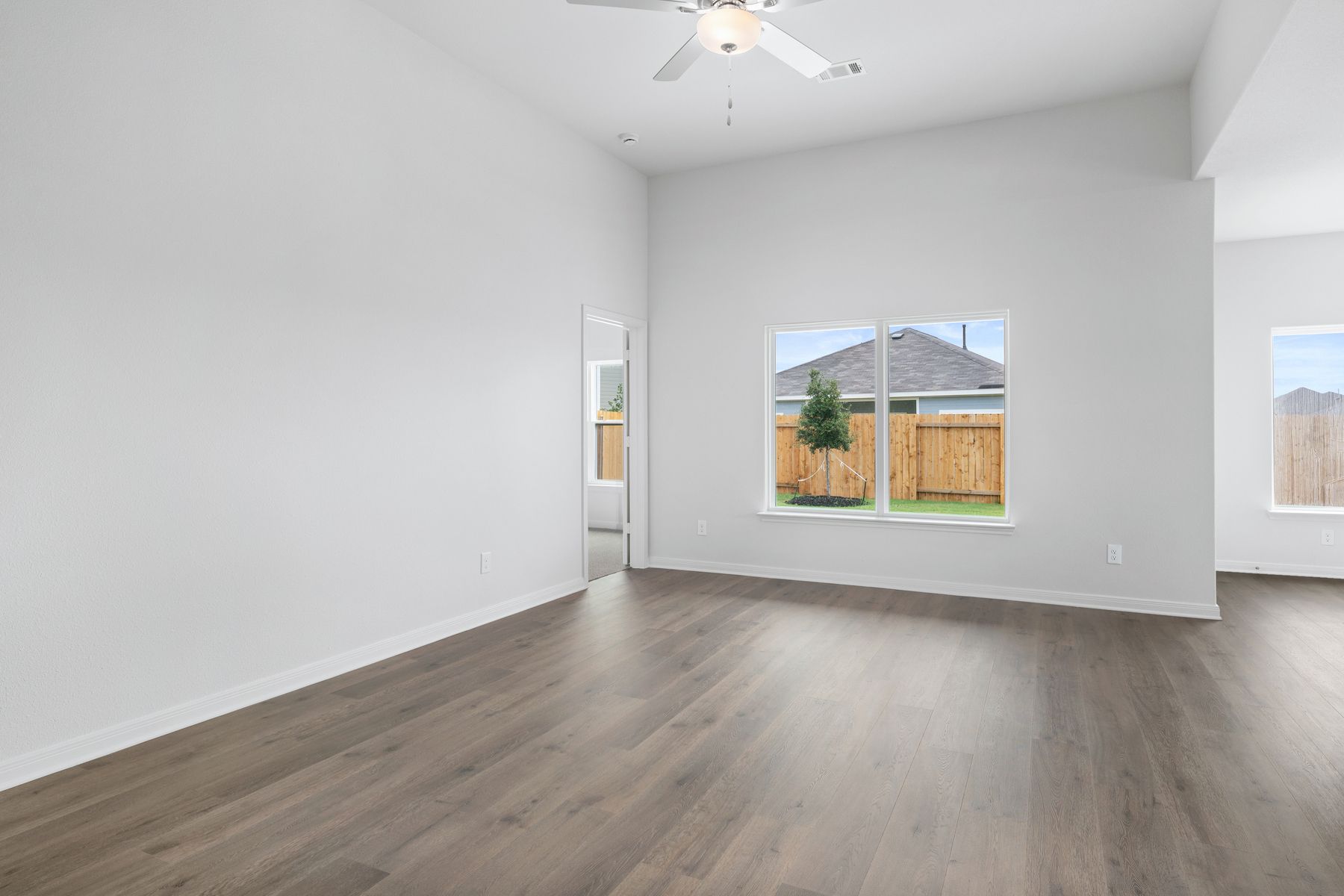 The family room has large windows that let in great, natural light.