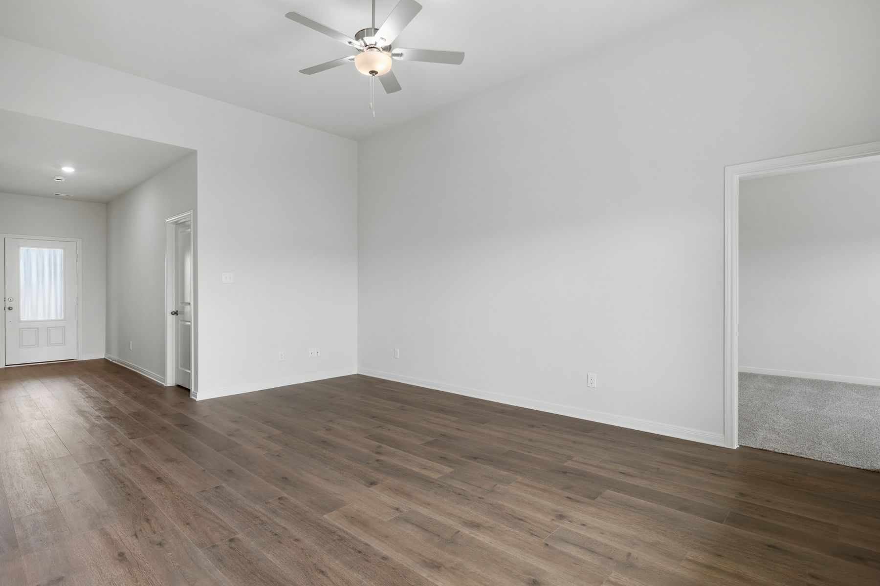 The family room is large and has plenty of space for furniture.