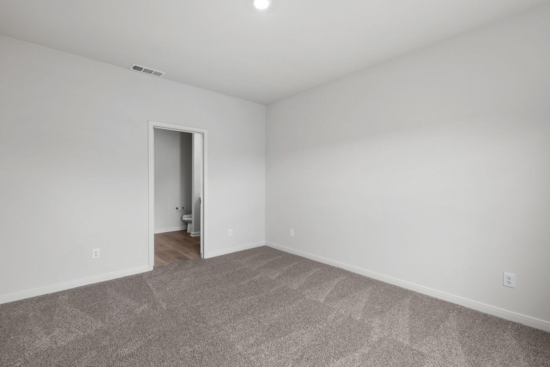The master suite has a large bedroom, ensuite bathroom and a walk-in closet.