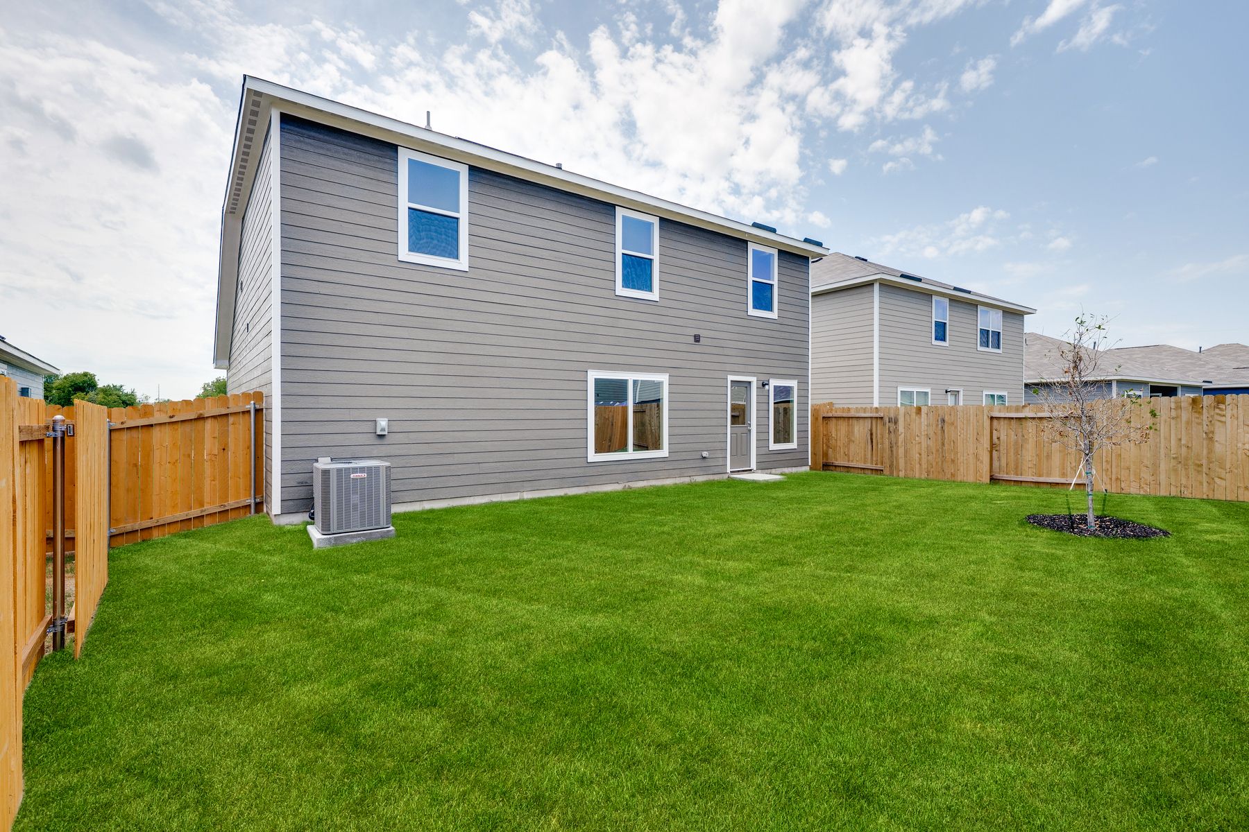 The back yard of the Cypress is fully fenced in.