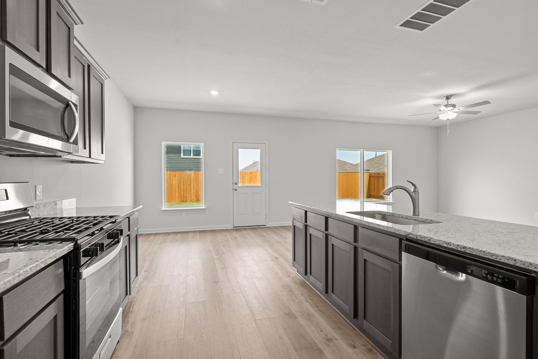 The kitchen of the Cypress has sprawling granite countertops.