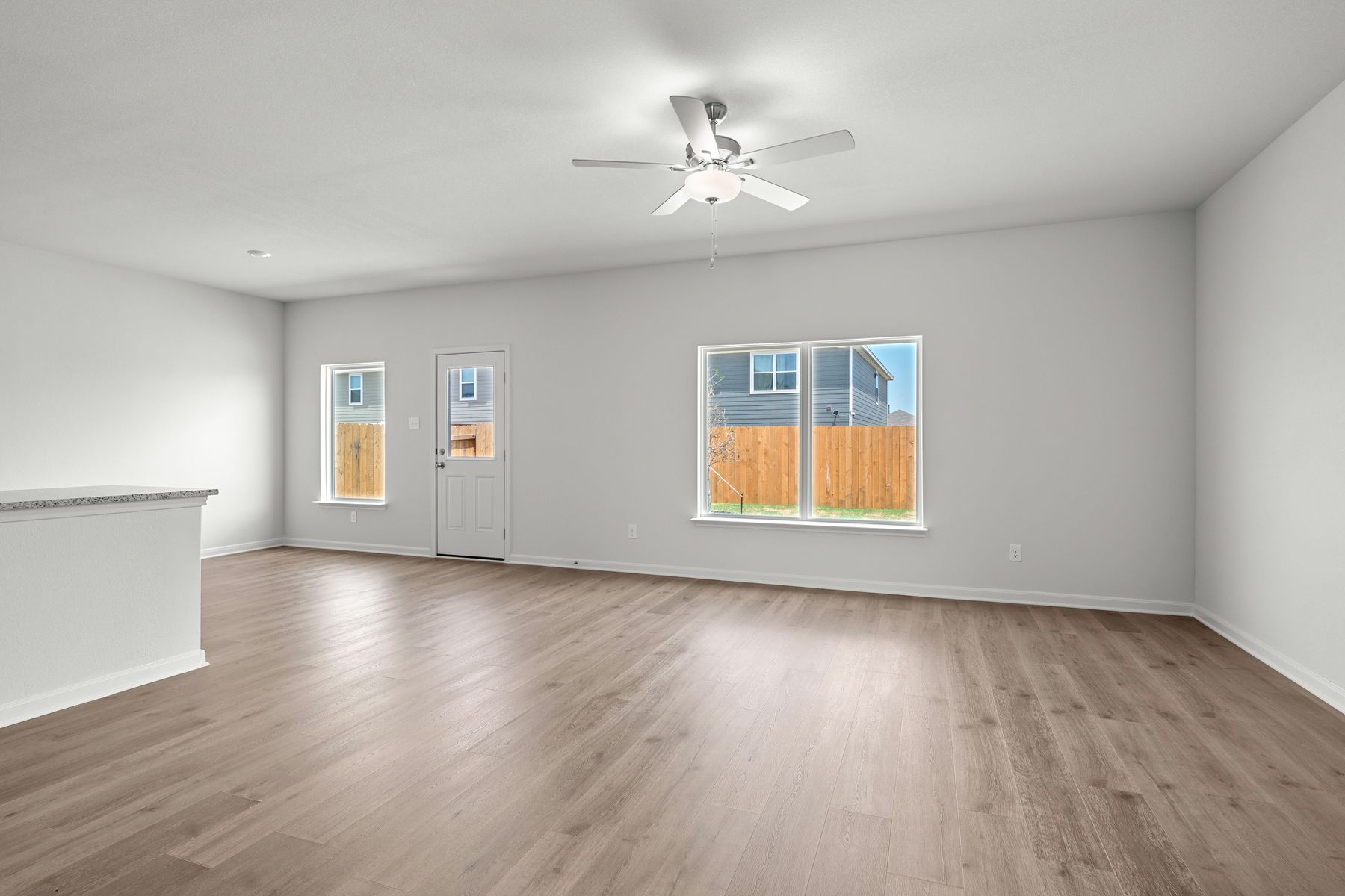 The living room has a large window that lets in great, natural light.
