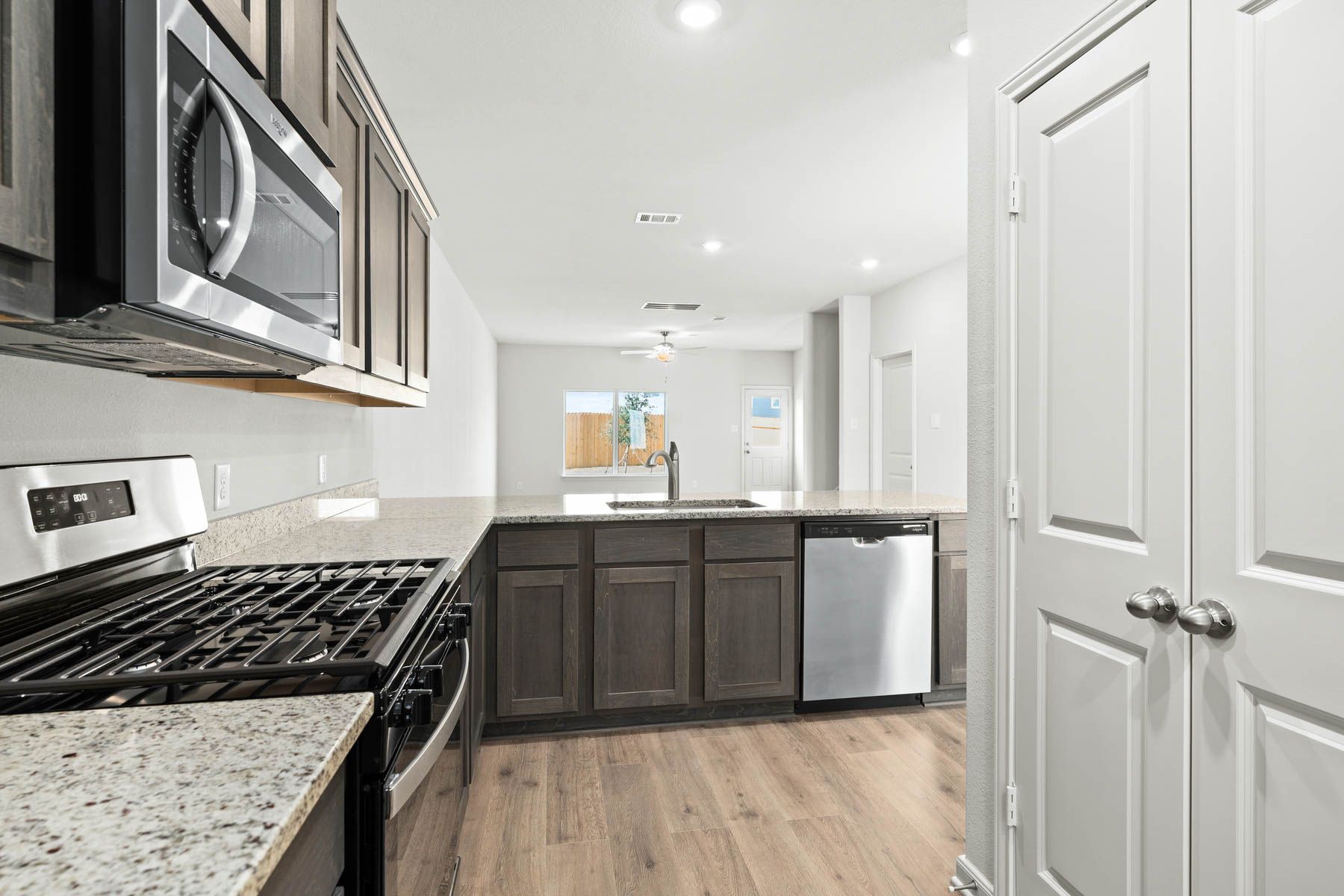 The kitchen of the Driftwood looks out into the dining room.