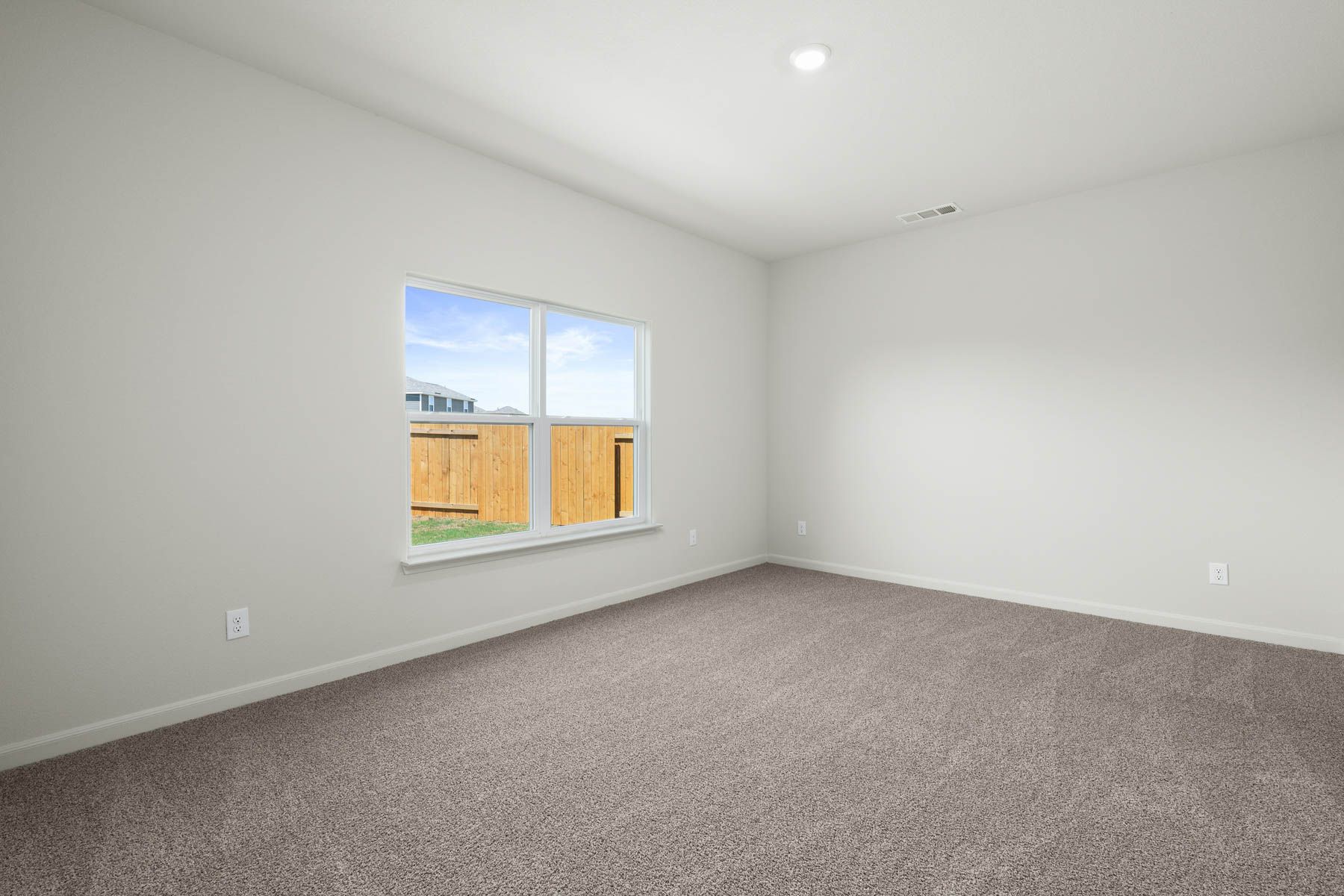 The family room of the Driftwood is spacious and has large windows.