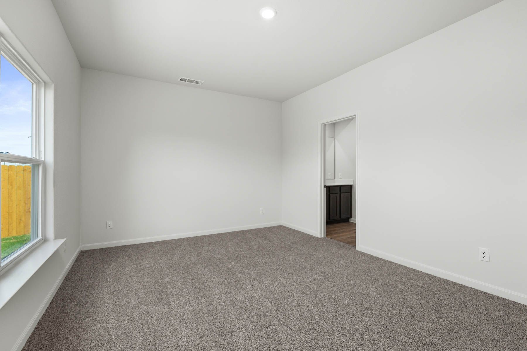 The master suite has a large bedroom, ensuite bathroom and walk-in closet.