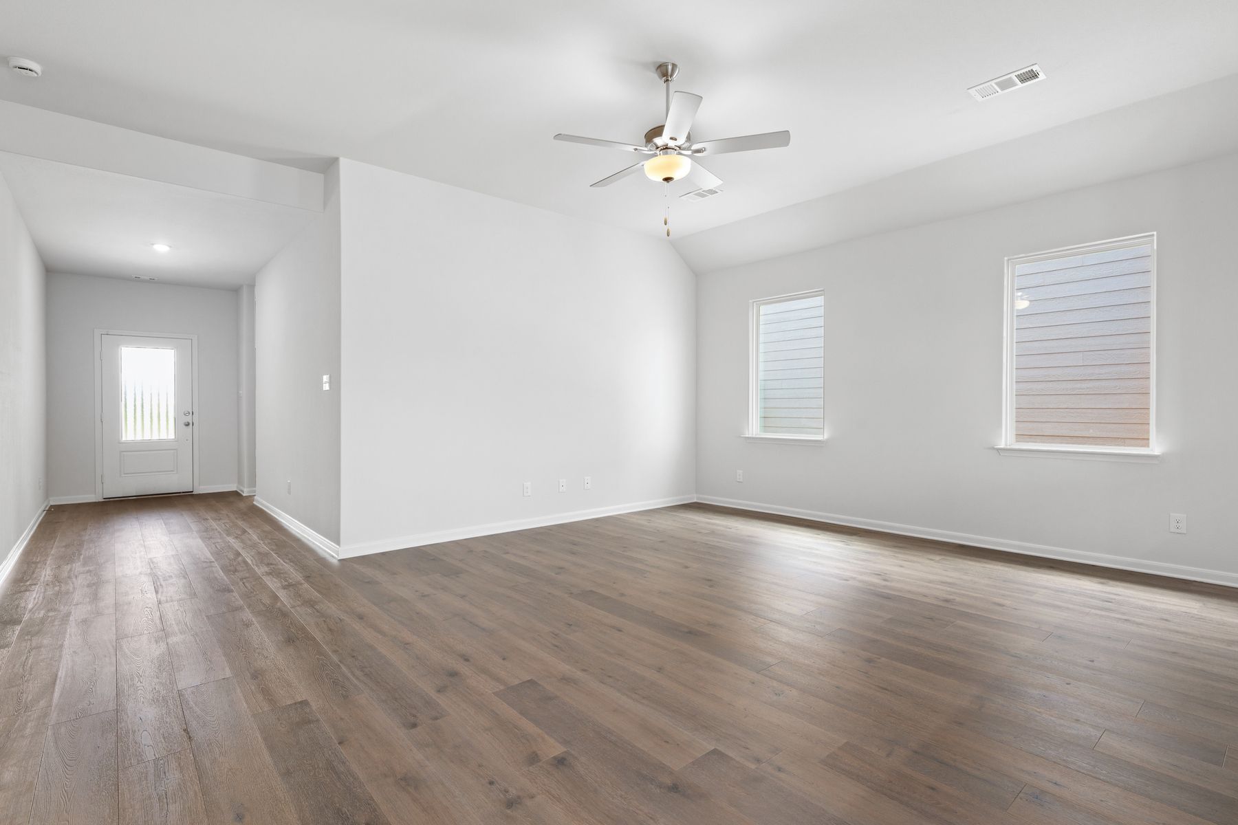 The family room of the Reed is spacious and has large windows.