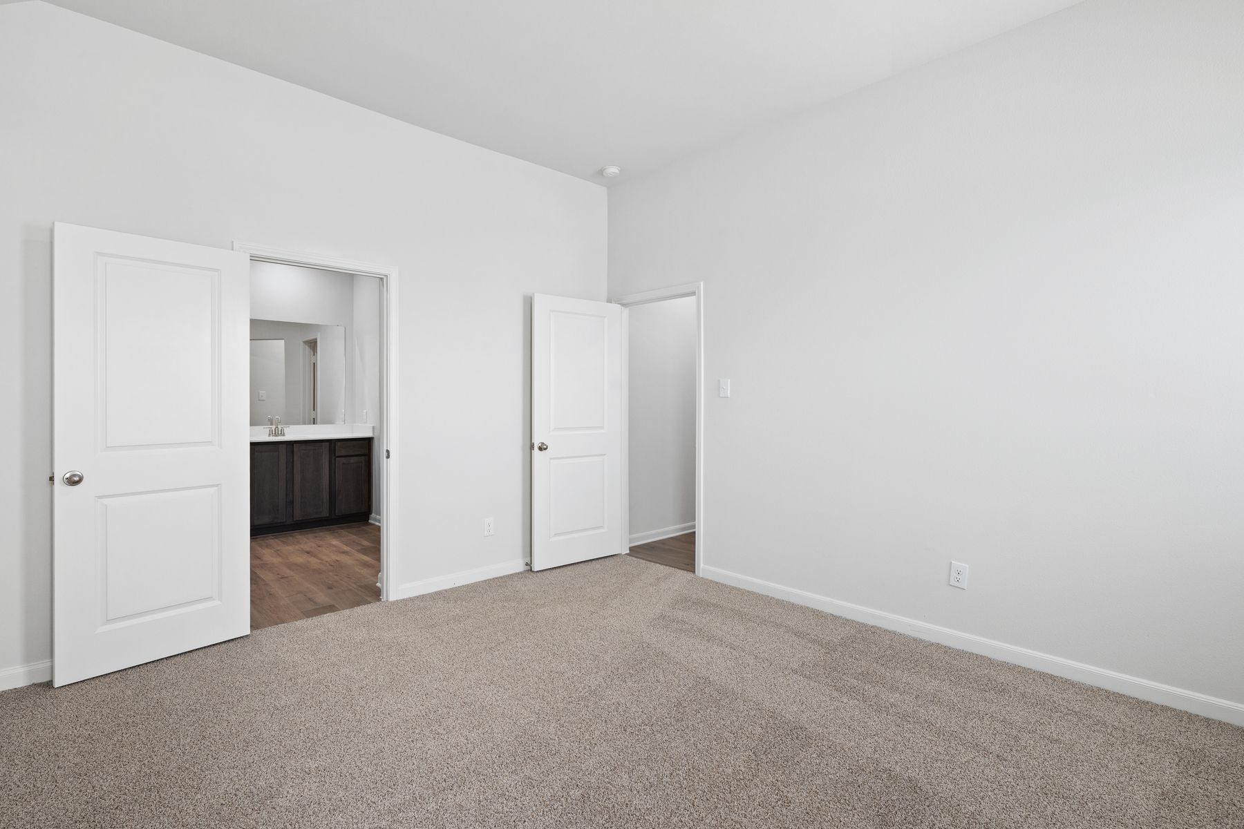 The master suite has a large bedroom, ensuite bathroom and a walk-in closet.