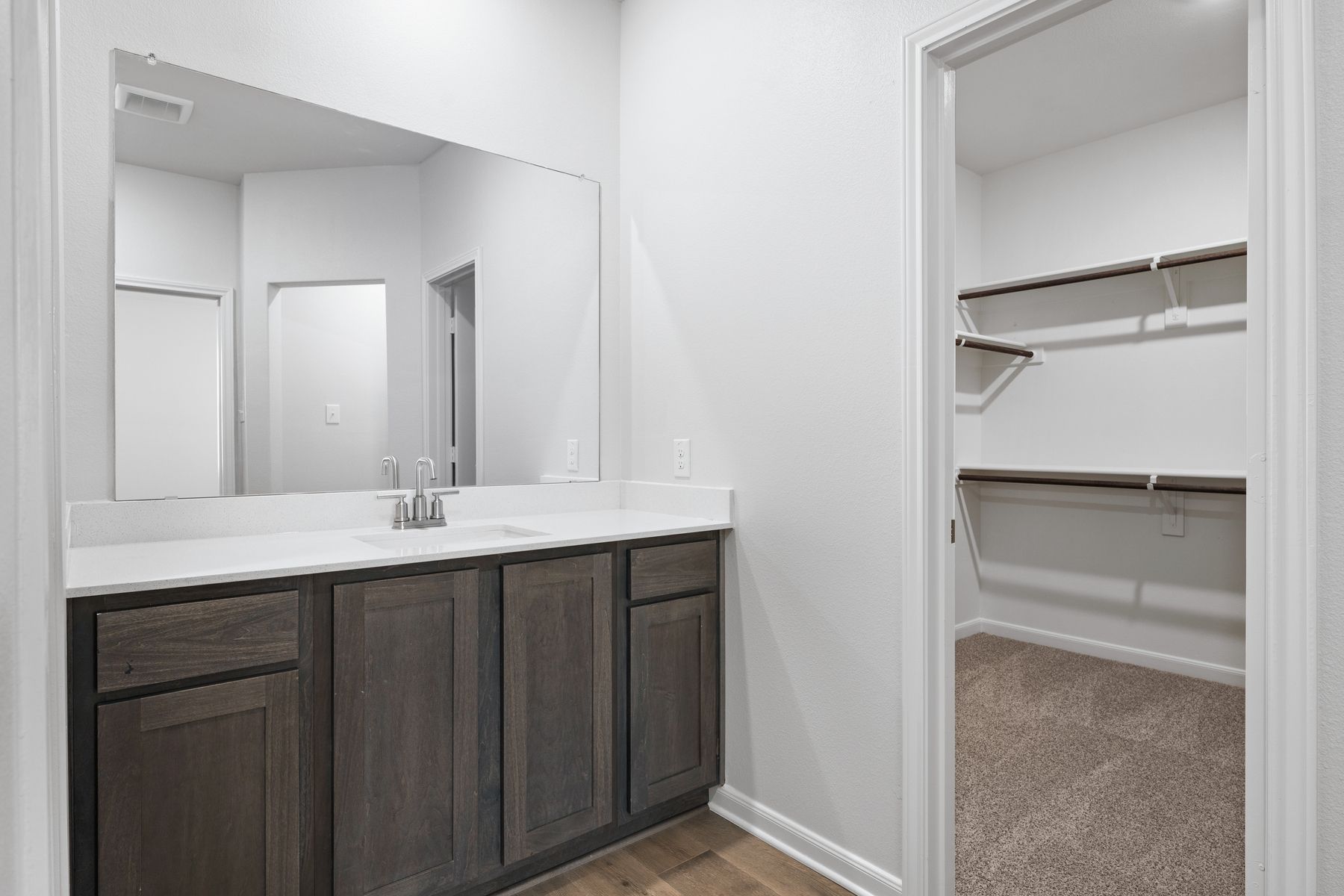 The master bathroom has a large vanity.