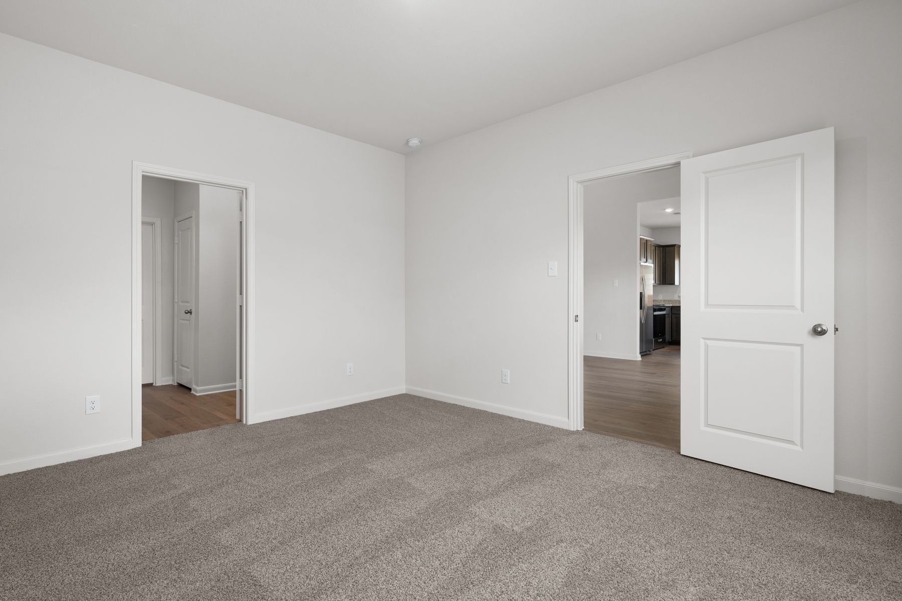 The master suite has a large bedroom, ensuite bathroom and walk-in closet.
