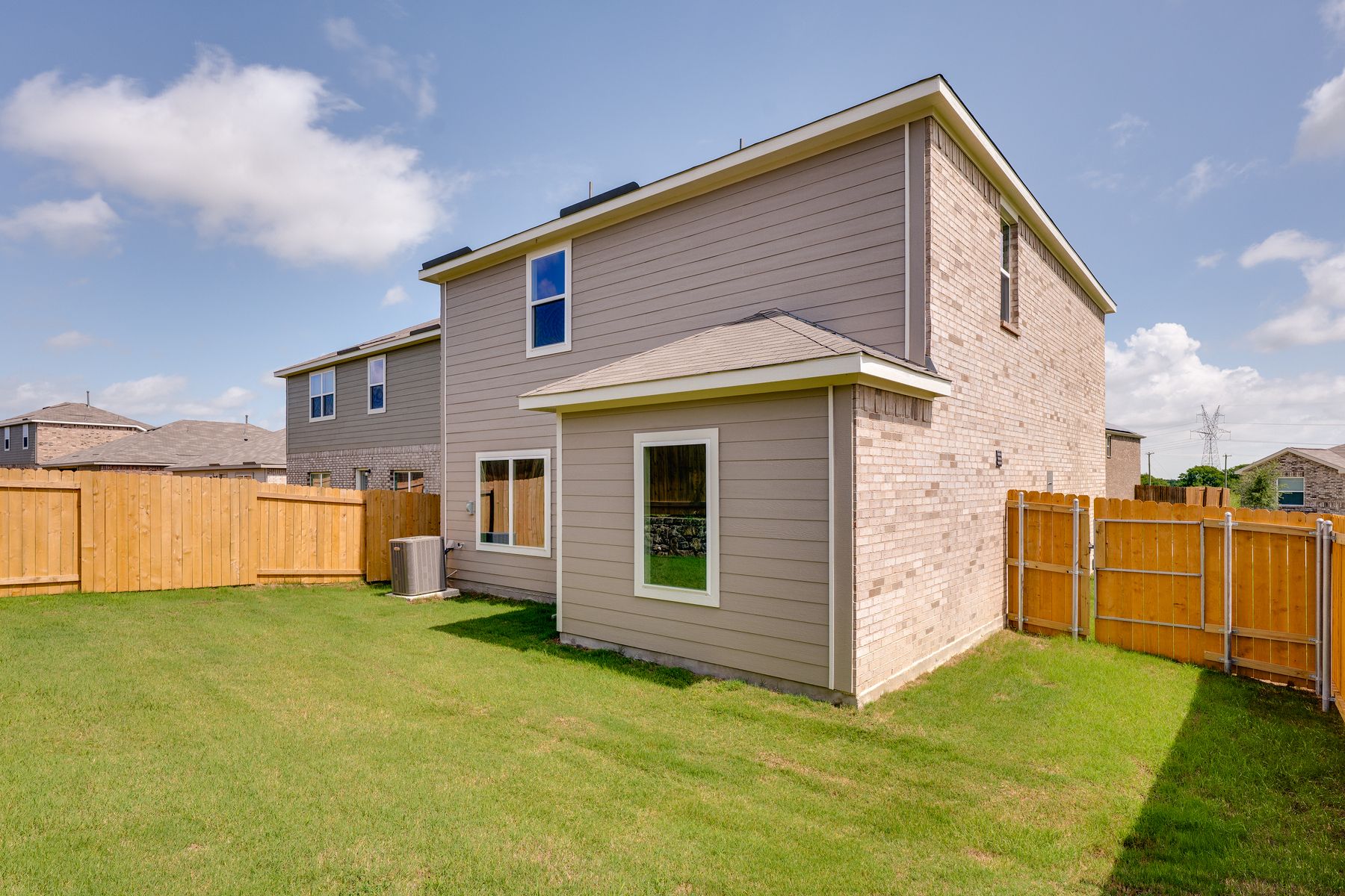 The back yard of the Colorado plan is fully fenced-in.