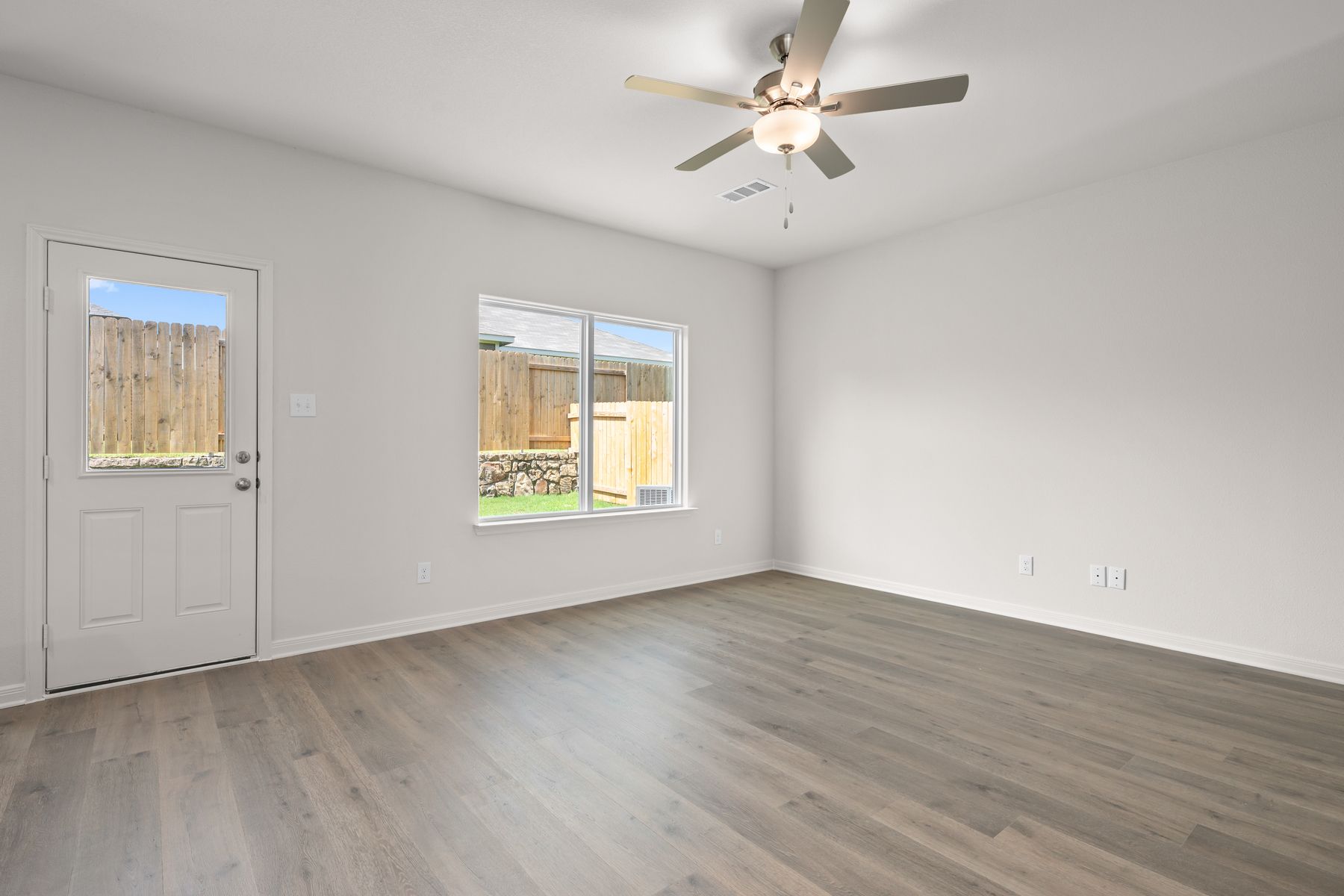 The spacious family room is perfect for family living and hosting.