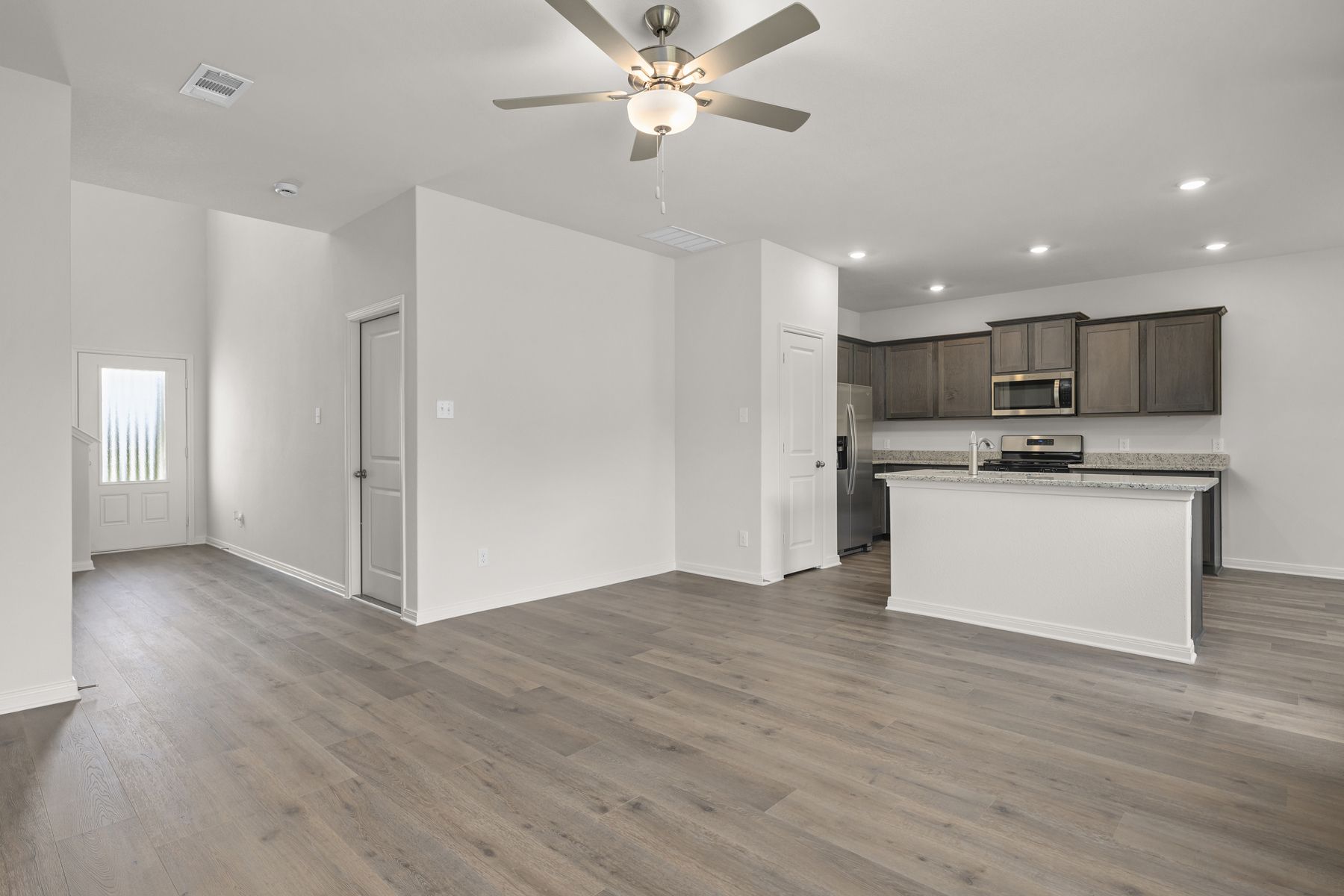 The kitchen and living room sit adjacent to one another.