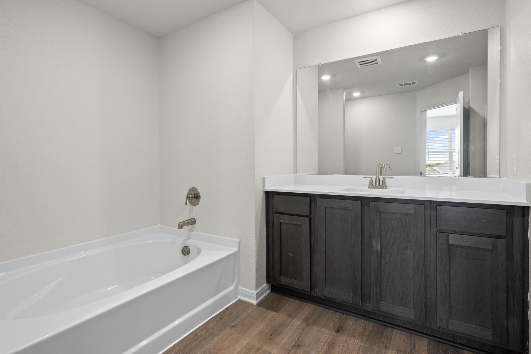 The master bathroom has a garden tub.