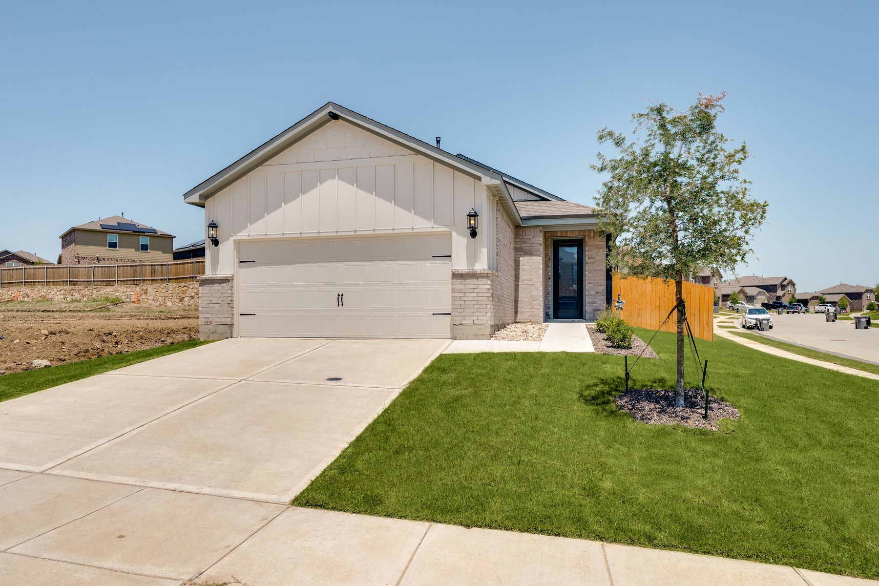 The Alfalfa is a brick home with siding details.