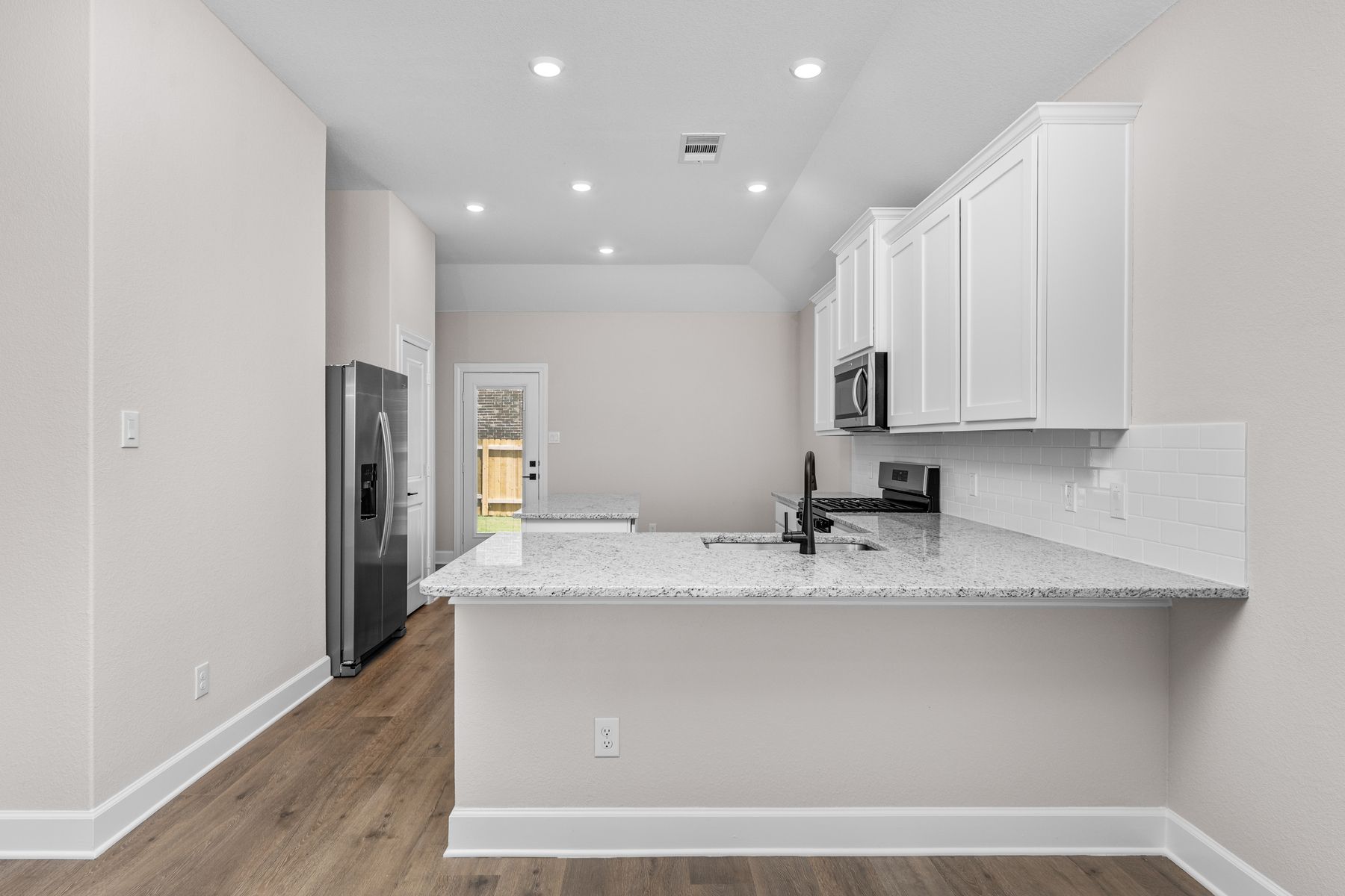 The dining room sits right off of the kitchen.