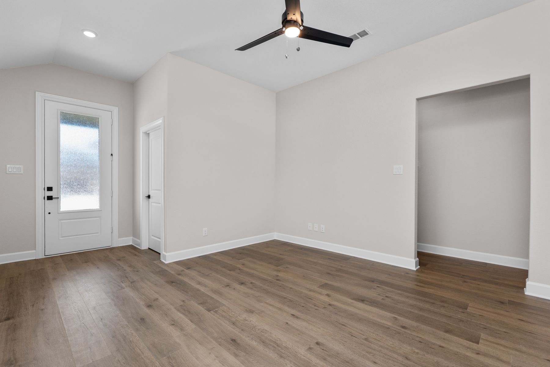 The living room has plenty of space to gather with family and friends.