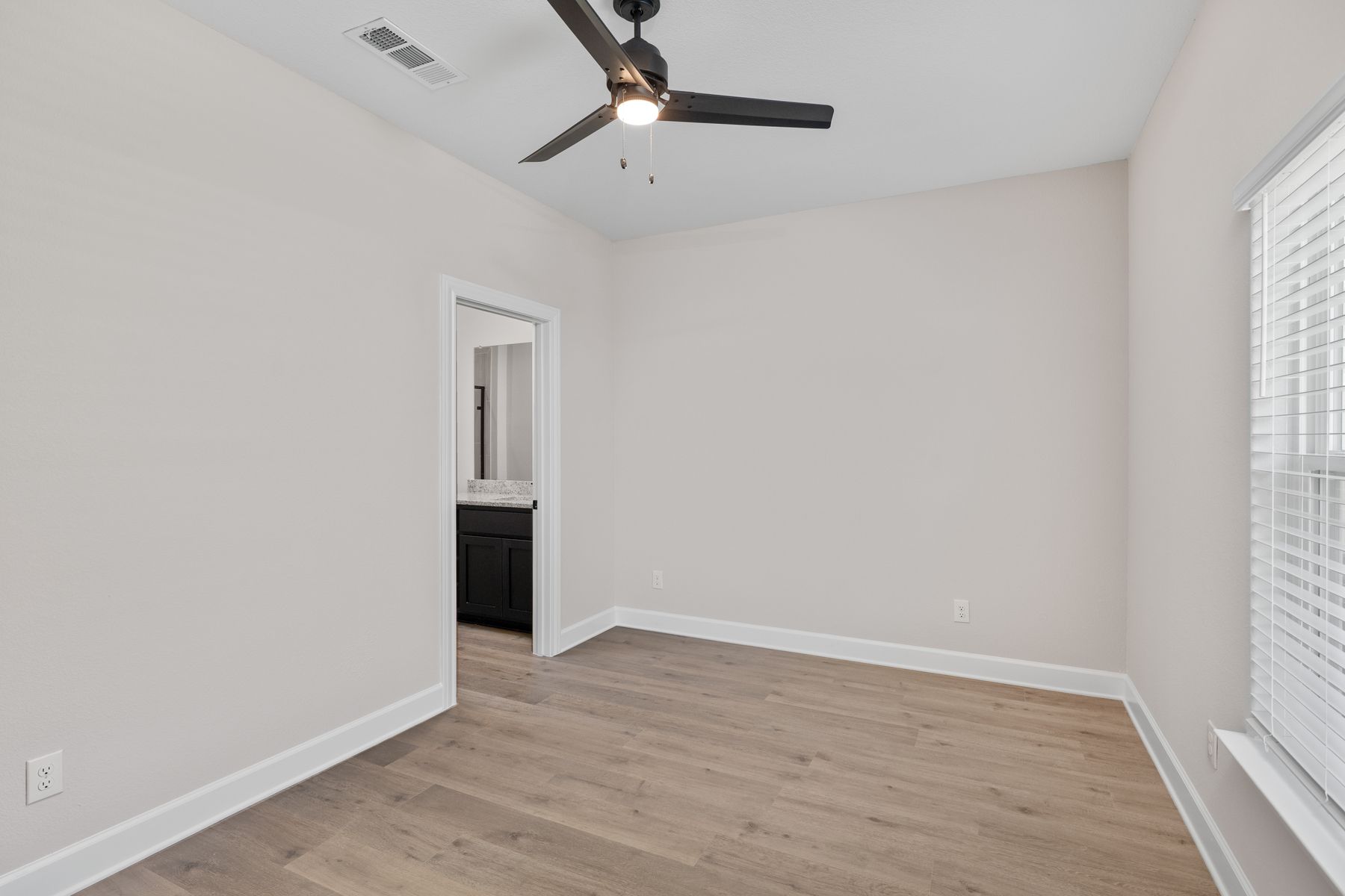 The master suite has a large bedroom, ensuite bathroom and a walk-in closet.