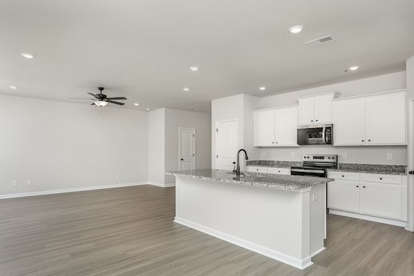 Kitchen overlooks the dining area