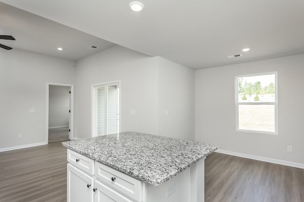 The kitchen overlooks the living area