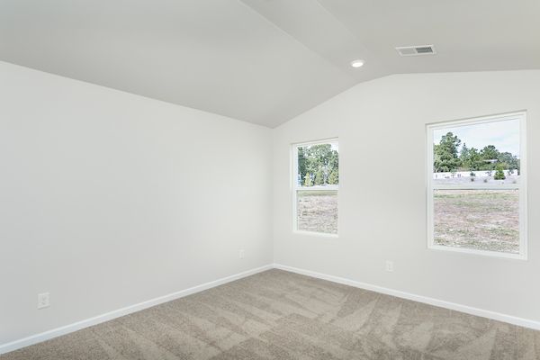 The master bedroom has cathedral ceilings