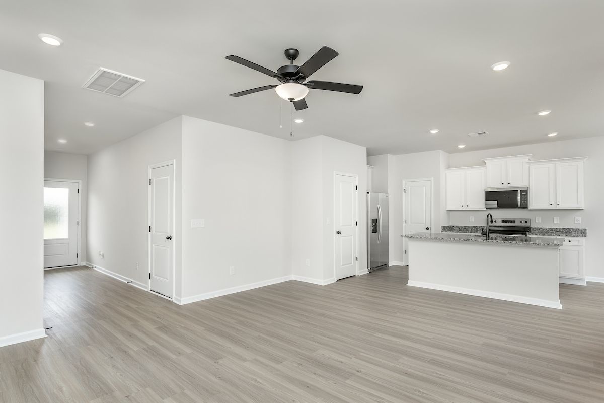 The kitchen opens to the dining area
