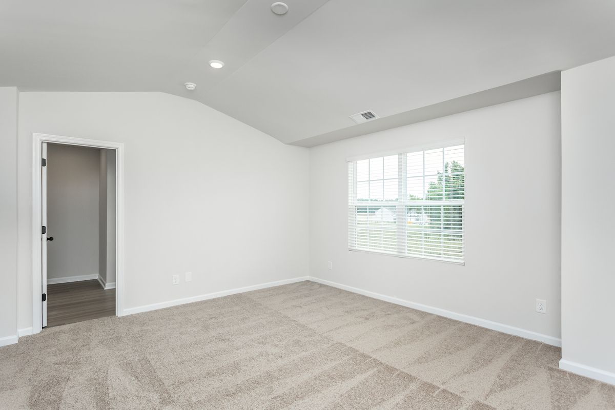 The master bedroom has an en-suite bathroom and walk-in closet
