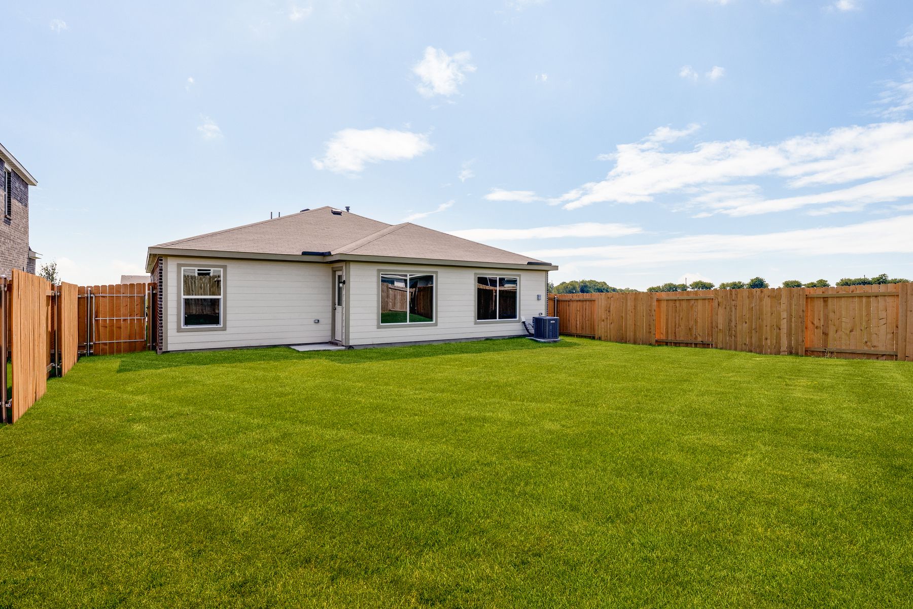 The back yard of the Ashton is fully fenced.