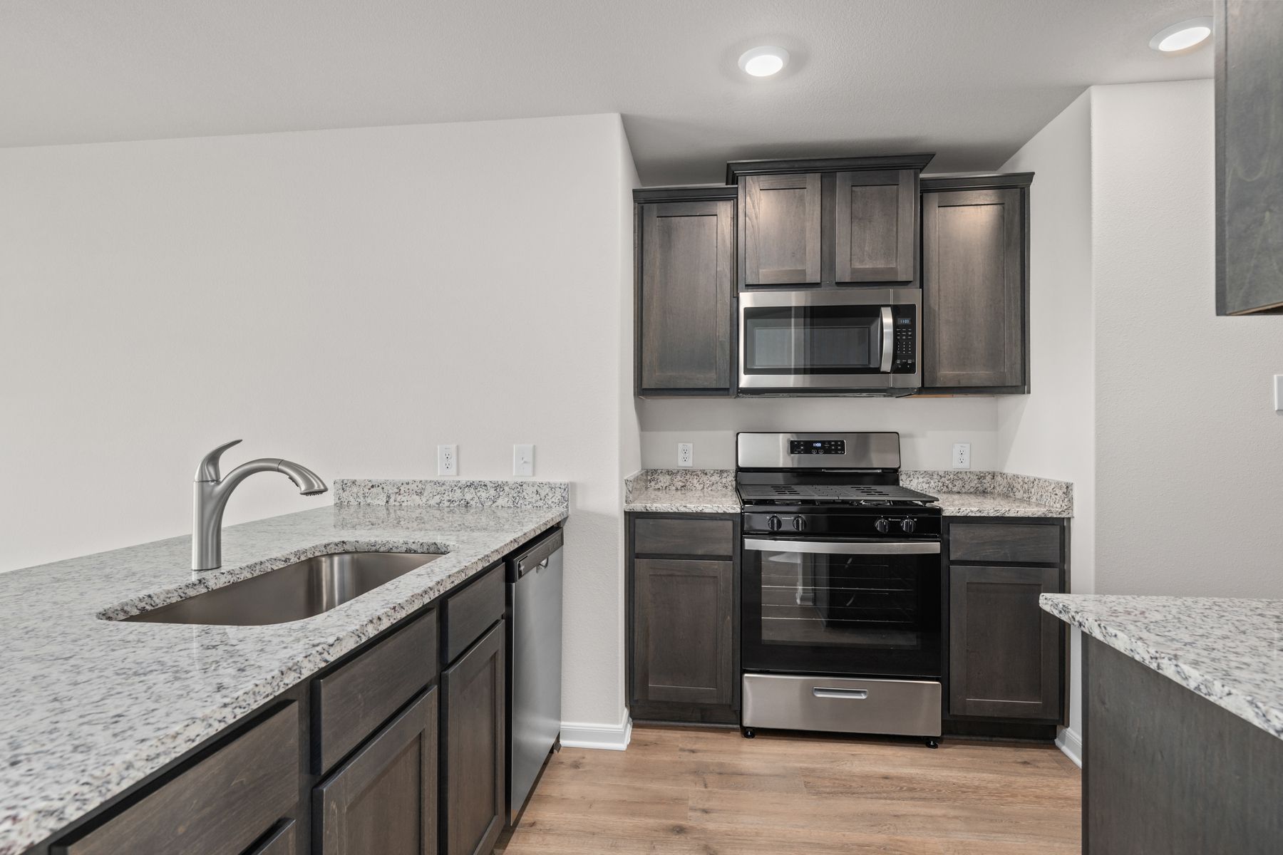 The kitchen has sprawling granite countertops.